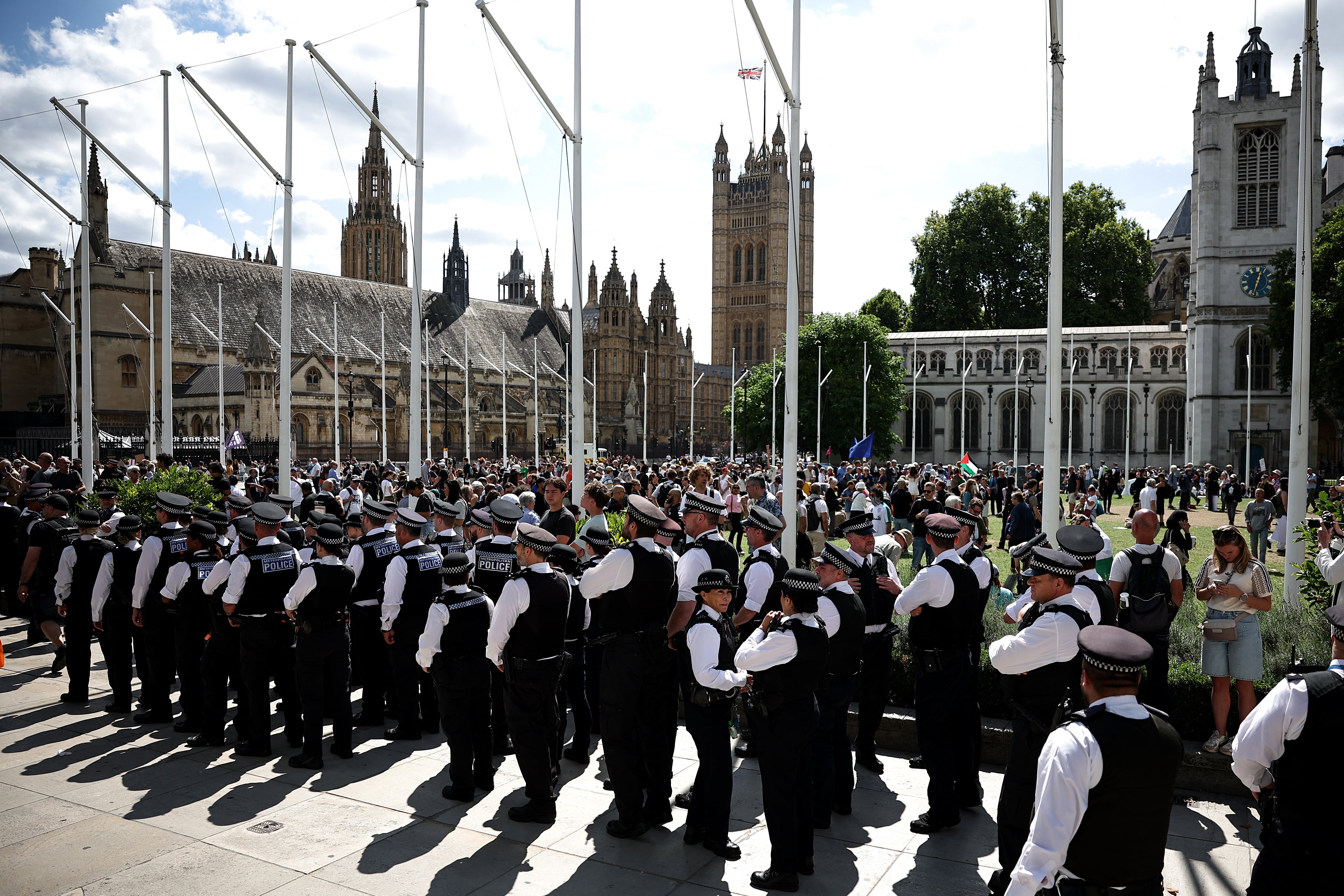 Members of the Metropolitan Police gather in Parliament Square ahead of a demonstration in support of the proscribed group Palestine Action