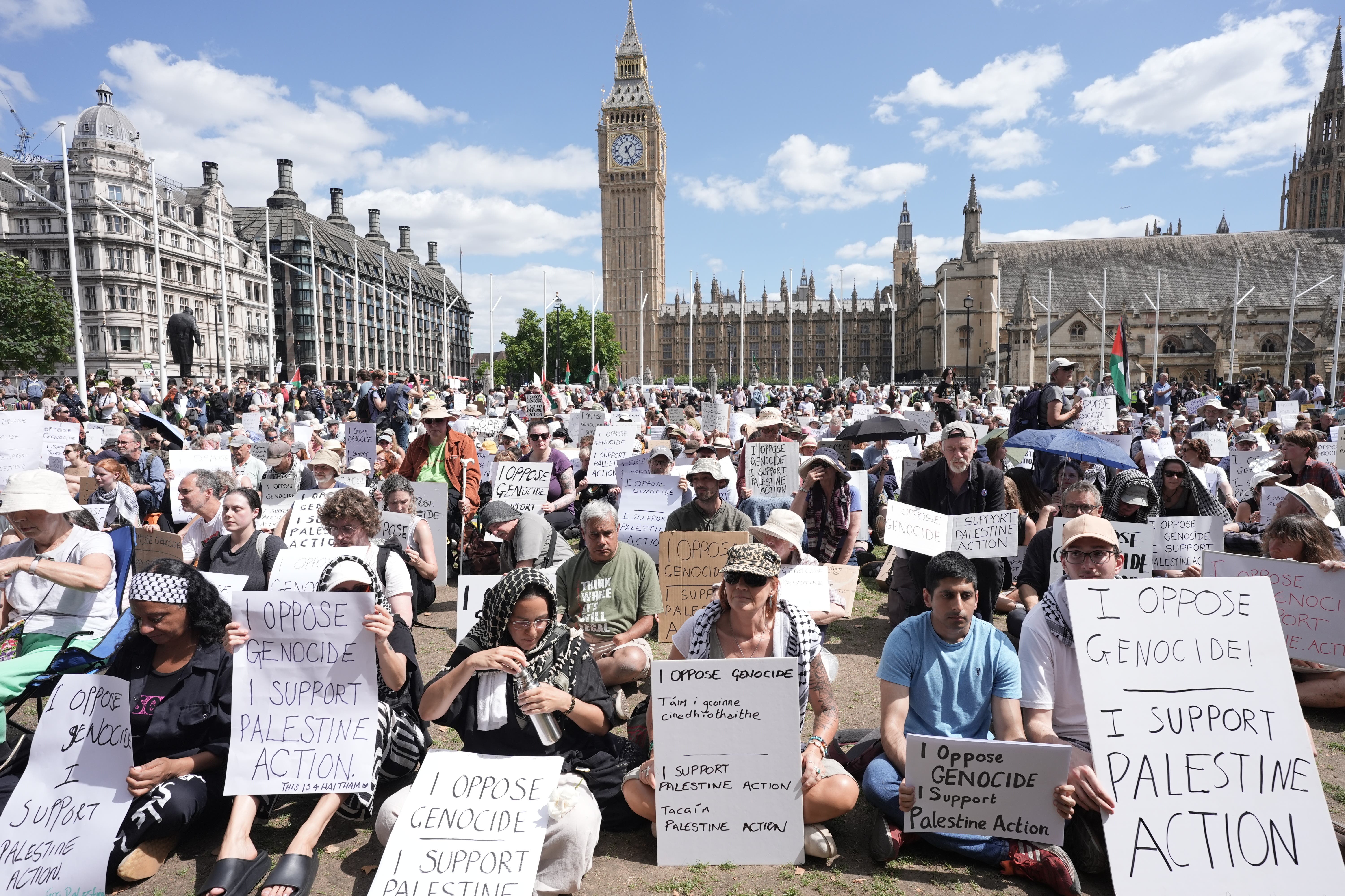 Protesters sat on the grass in Parliament Square during Saturday’s demonstration