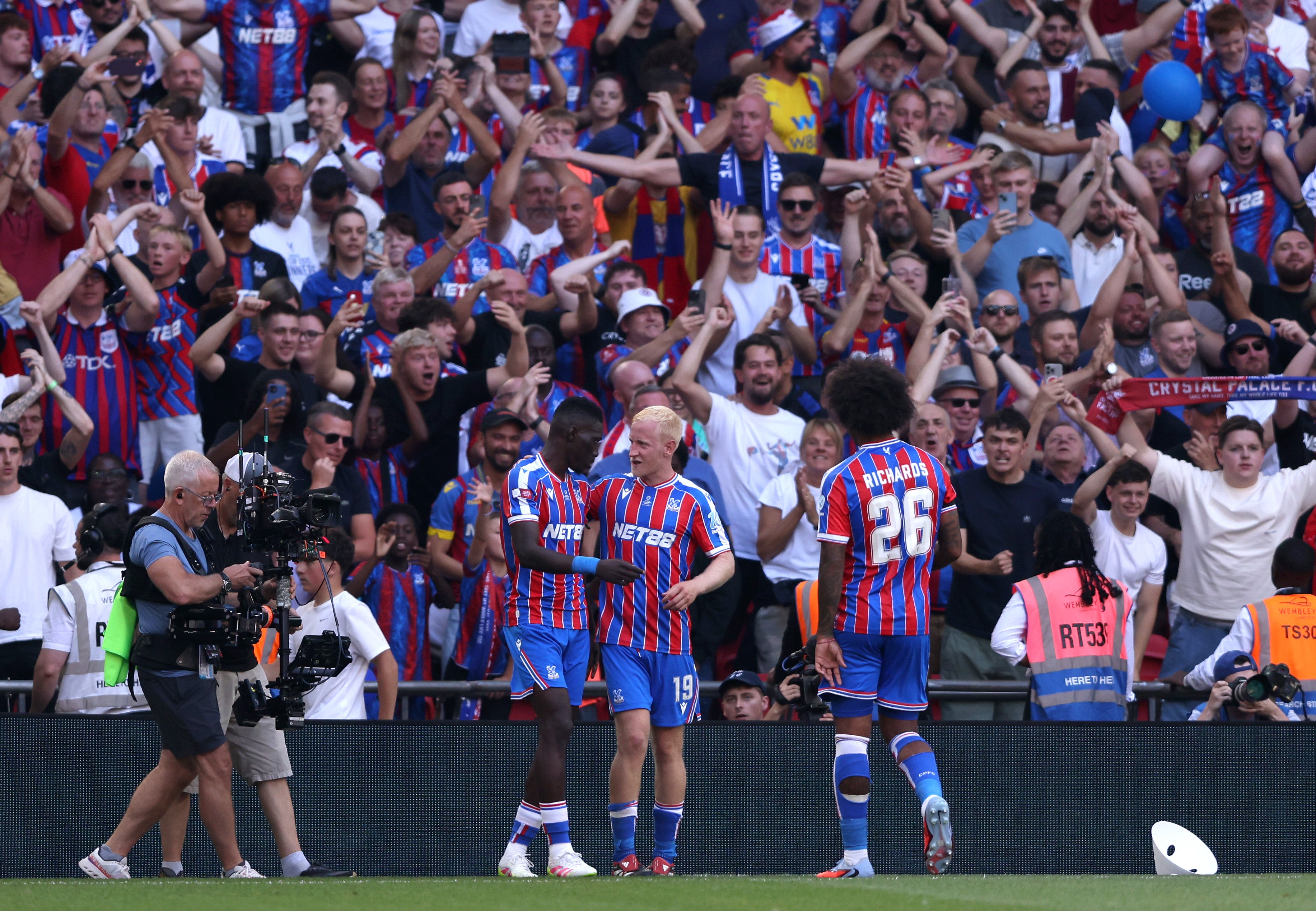 Sarr celebrates with Palace teammate Will Hughes