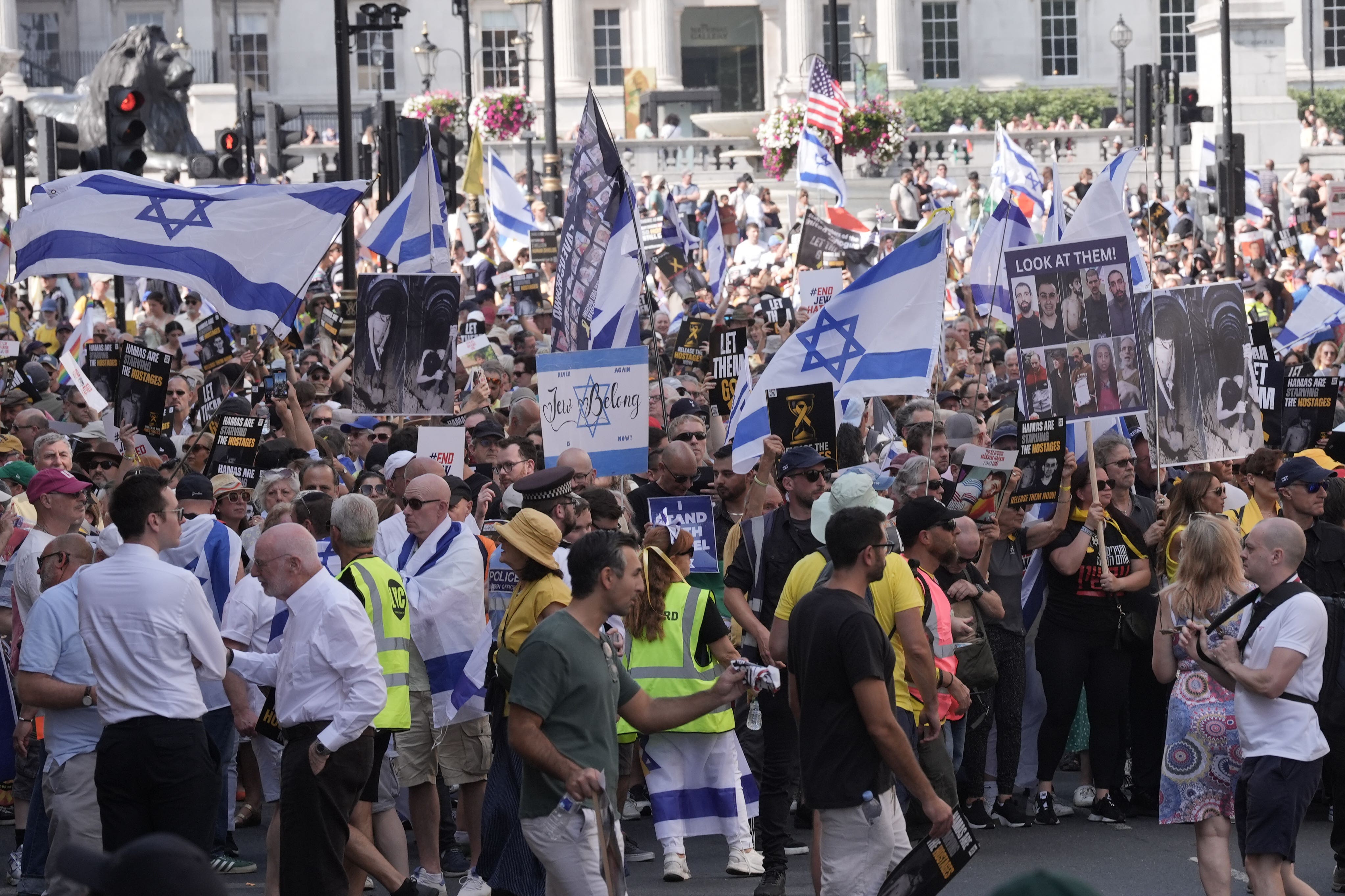Protesters waved Israeli flags and held placards depicting some of the hostages (Stefan Rousseau/PA)
