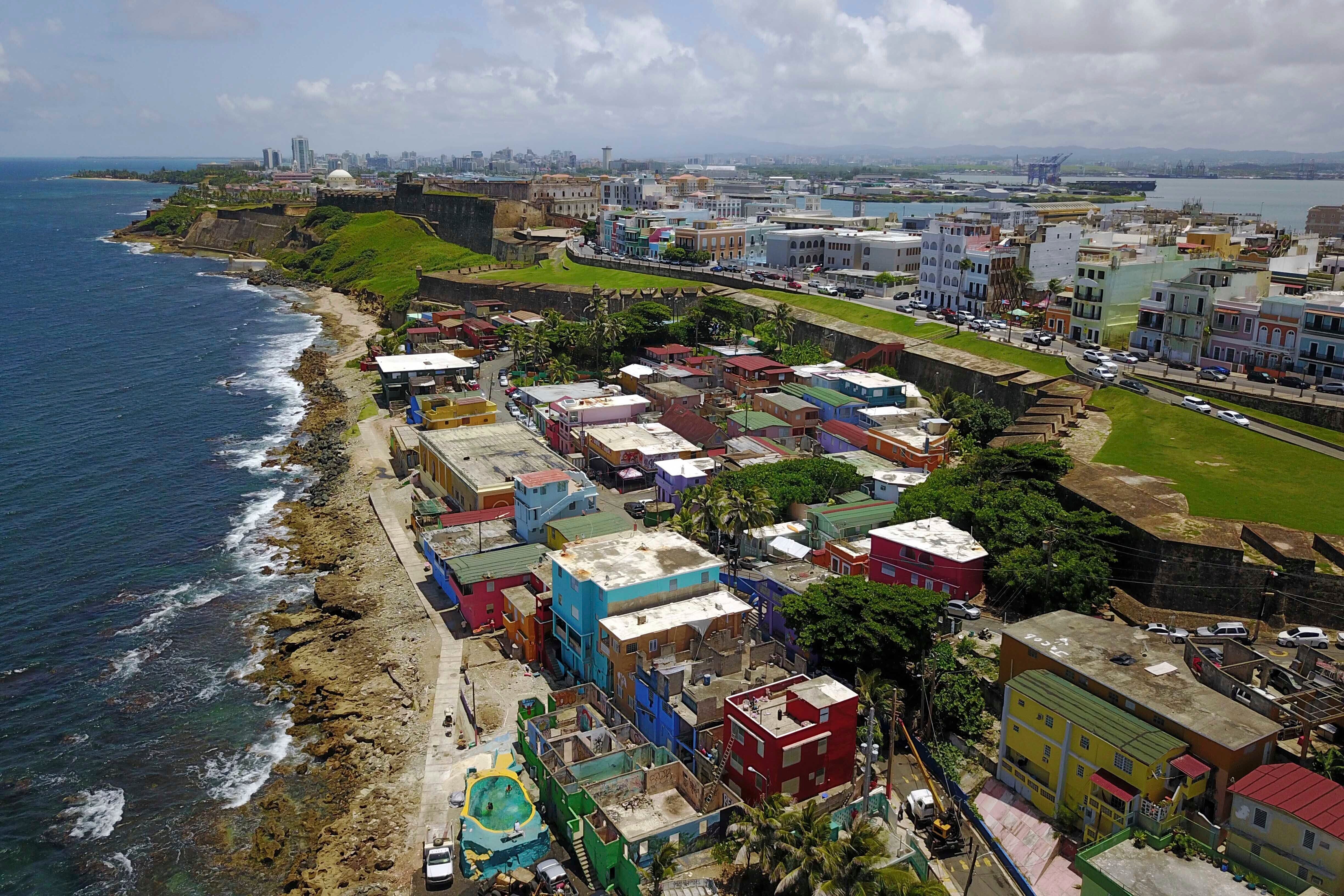 An aerial view of the seaside neighborhood of La Perla, in San Juan, Puerto Rico, is seen on Aug. 25, 2017. (AP Photo/Ricardo Arduengo, File)
