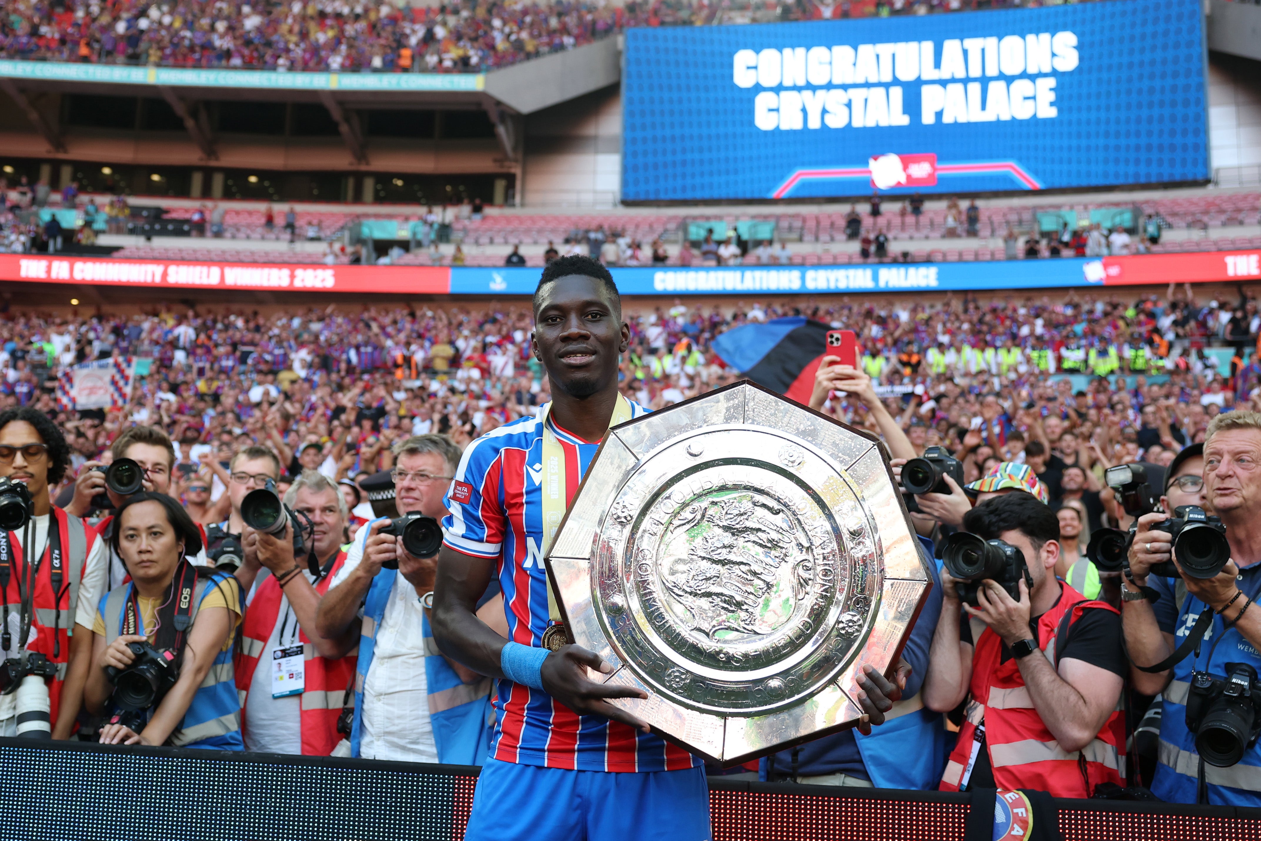 Ismaila Sarr poses with the Community Shield