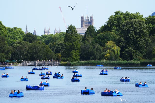 <p>Visitors to the Serpentine take to pedalos in Hyde Park, London</p>