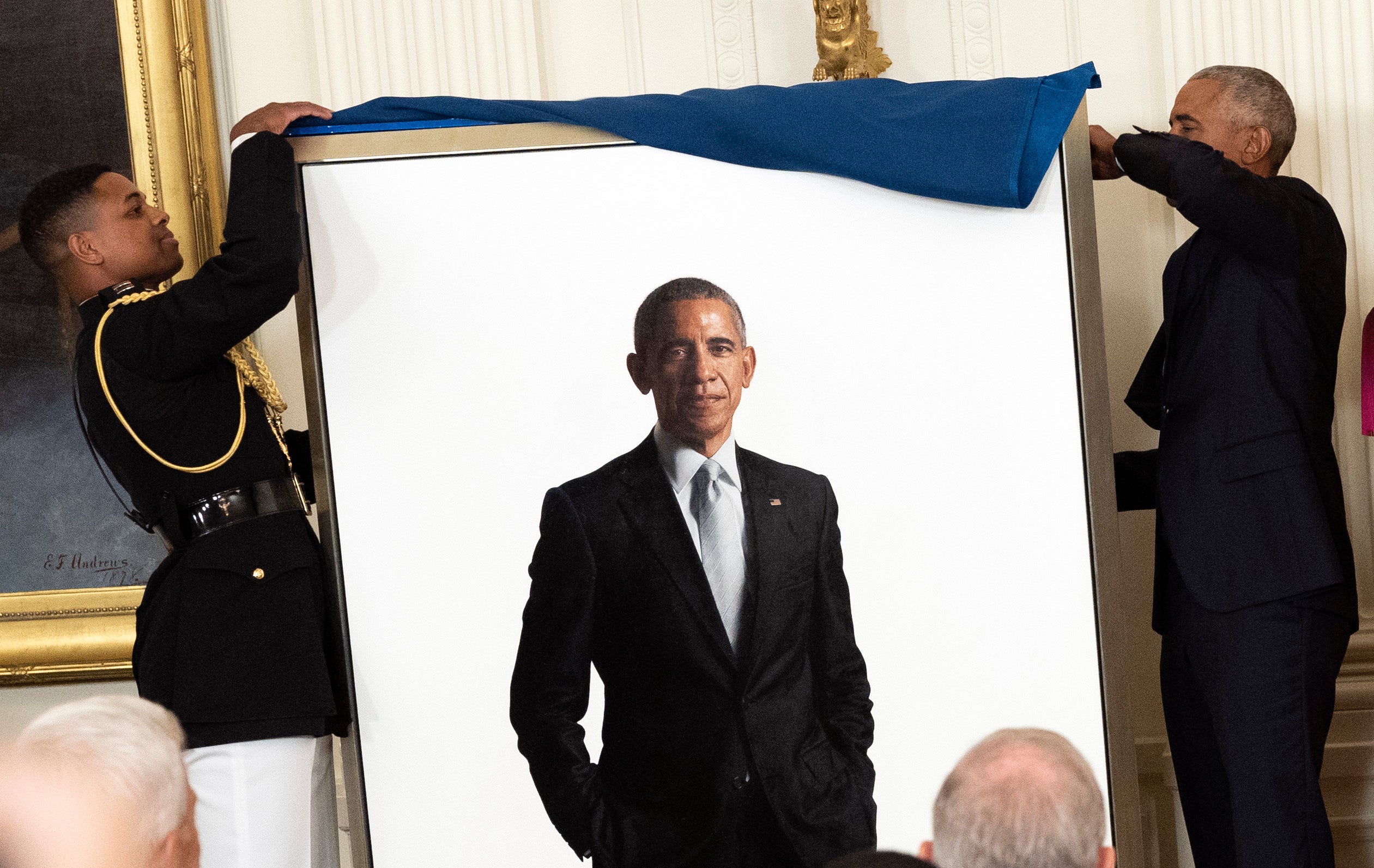 Former President Barack Obama's official White House portrait, seen in 2022 during an unveiling ceremony. The portrait is now out of view from visitors, a new report says