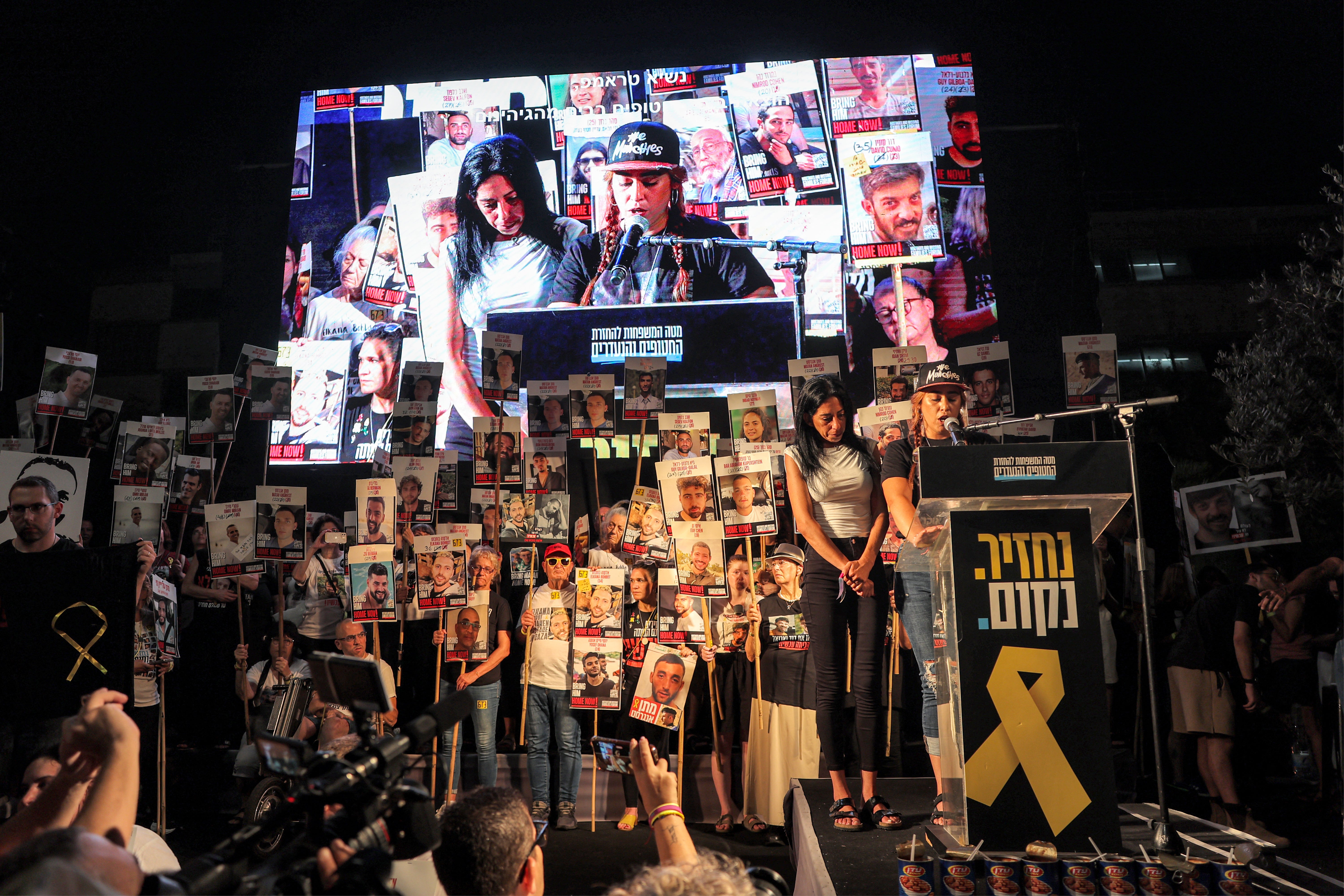 Ilana Gritsevsky (R), former Israeli hostage and girlfriend of current hostage Matan Zangauker, speak during a protest at