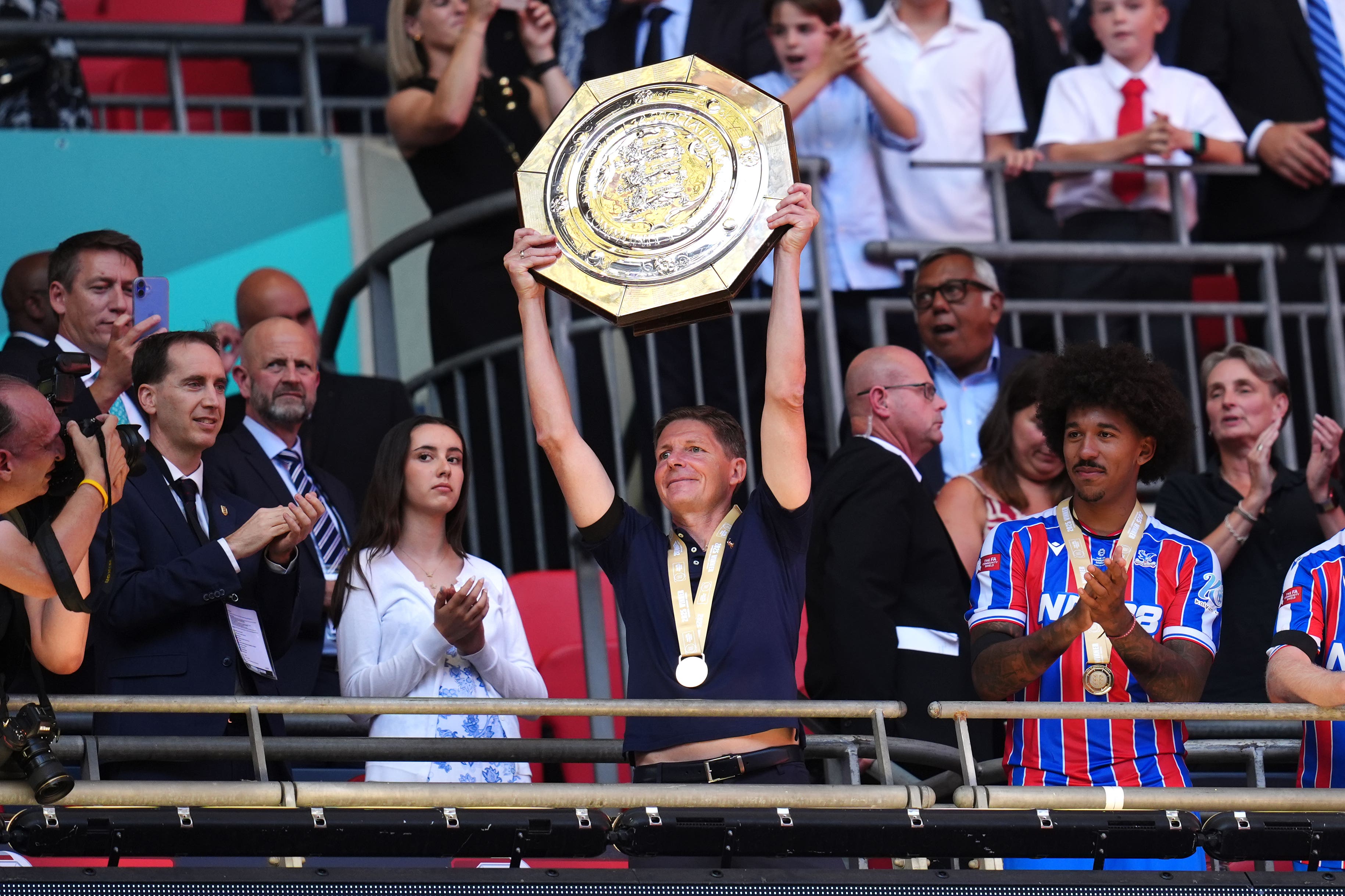 Oliver Glasner lifts the shield with players following Palace’s victory (John Walton/PA)