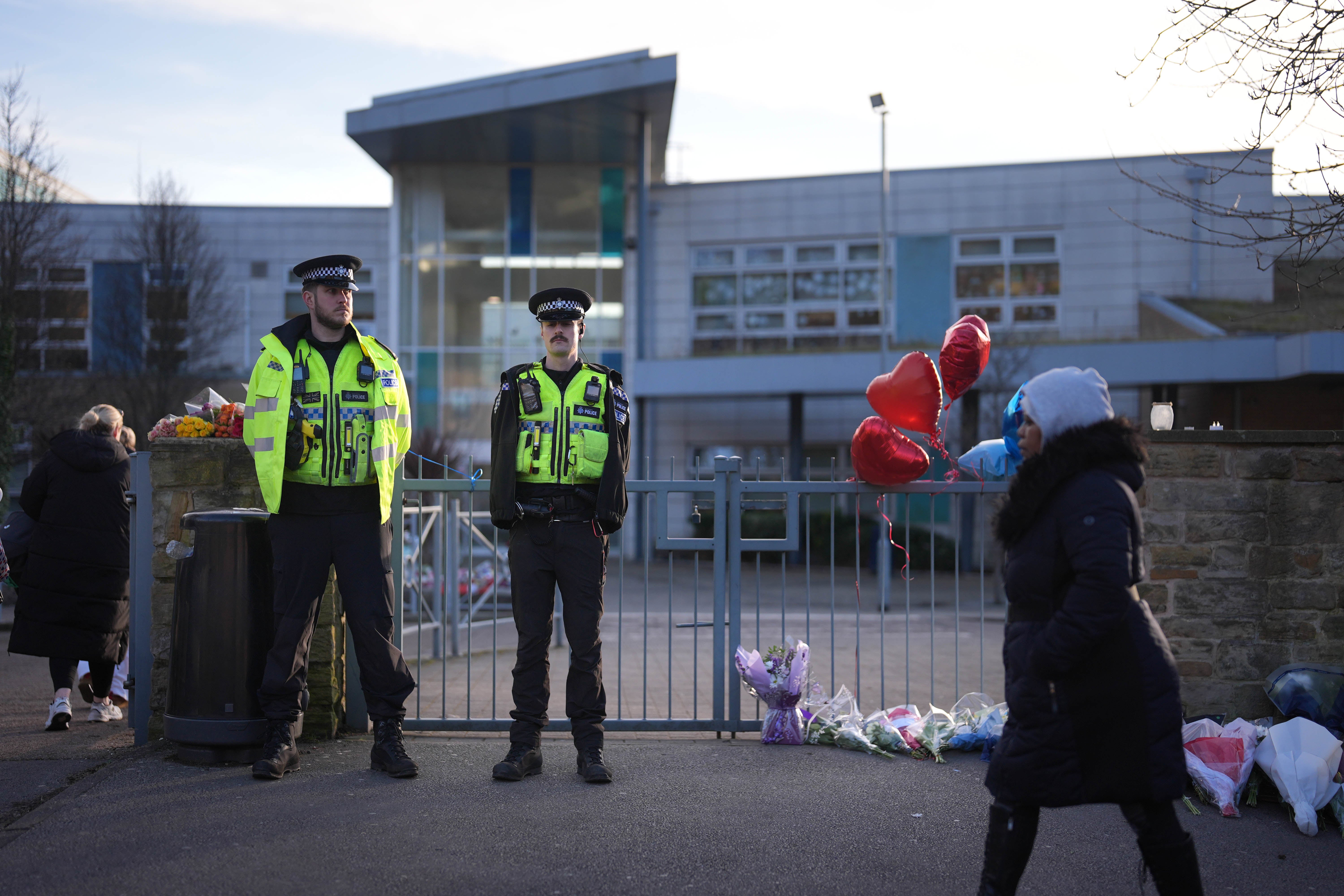 Police outside the school following the fatal stabbing