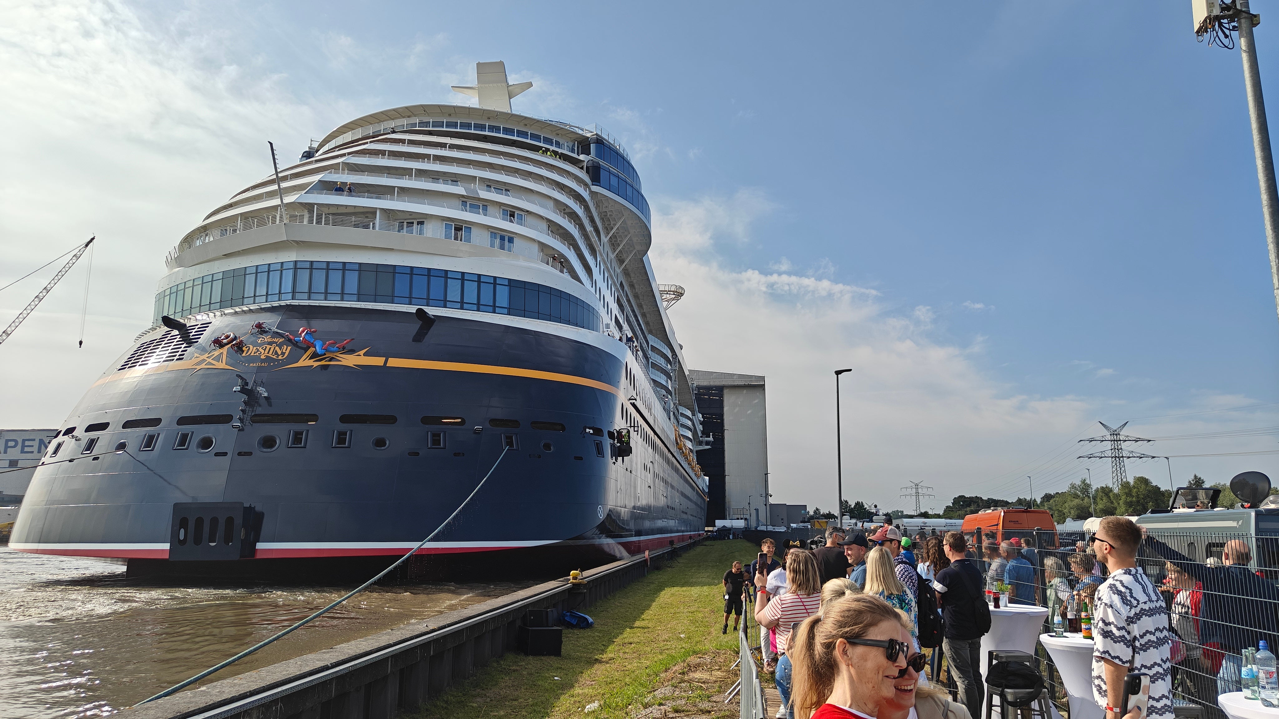 Crowds gathered to welcome Disney's latest cruise ship, which features Spider Man on the stern