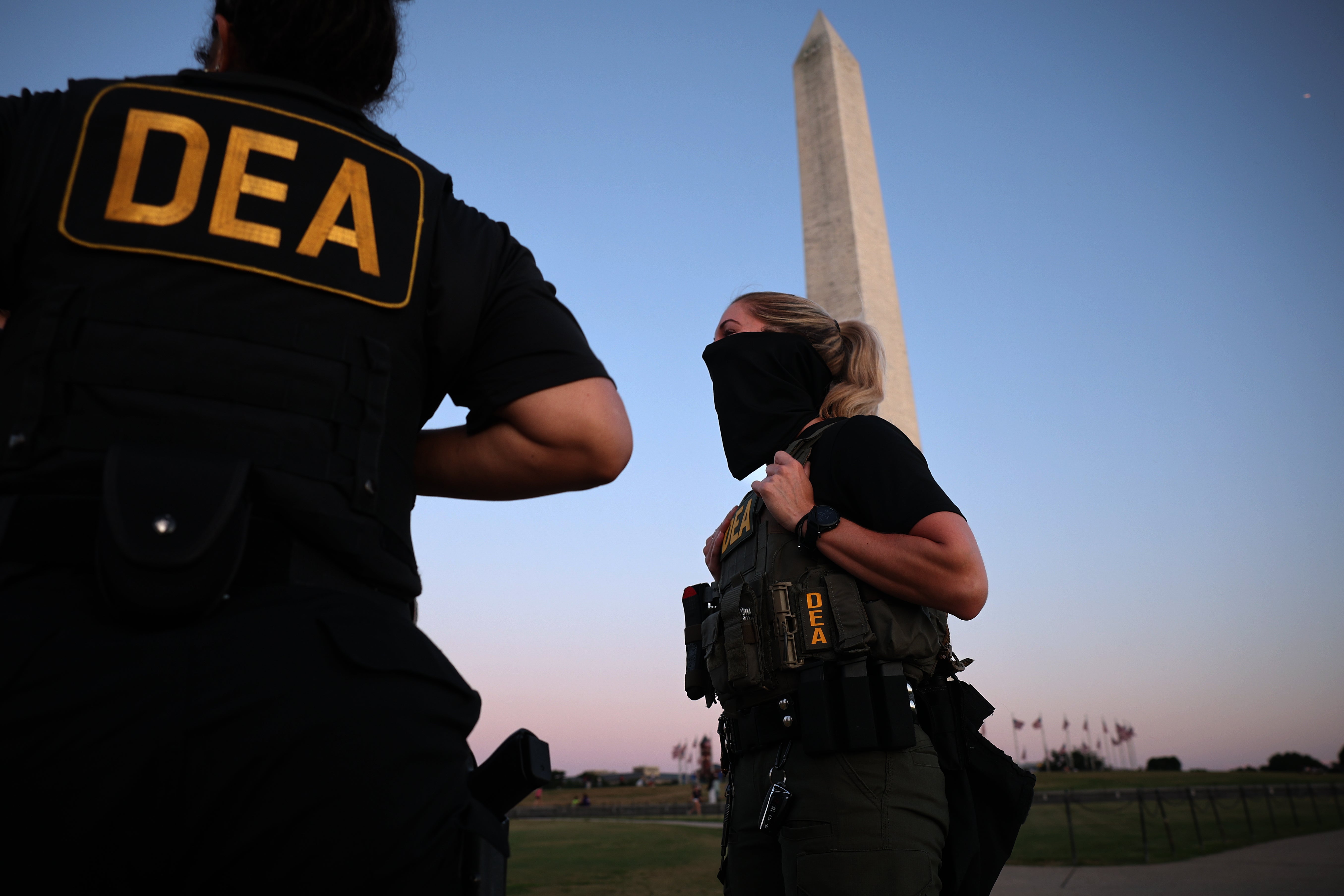 DEA agents guard the Washington Monument on Monday evening