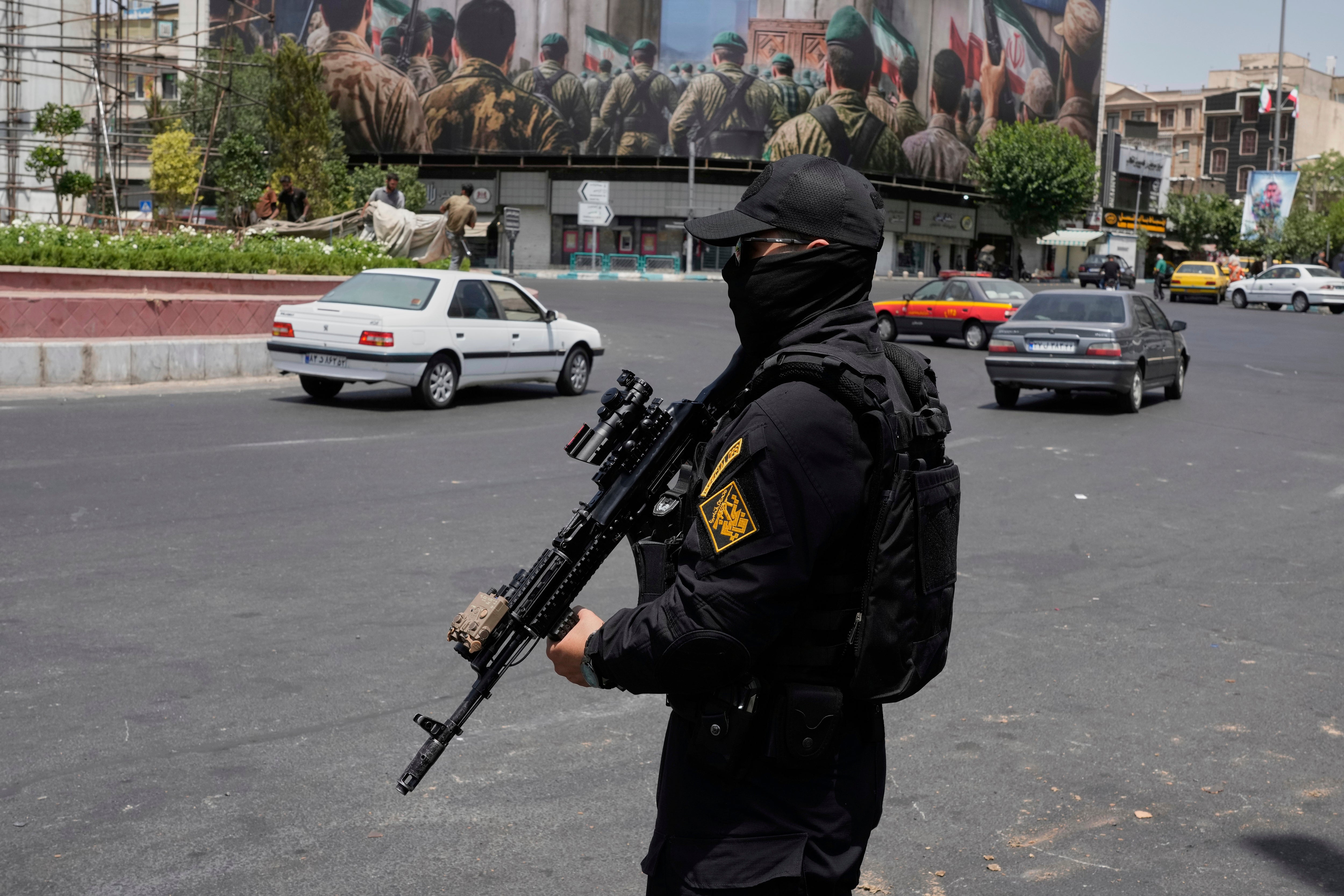 A member of Iran's Revolutionary Guard stands guard at Enqelab-e-Eslami (Islamic Revolution) square in downtown Tehran, Iran, Tuesday, June 24, 2025