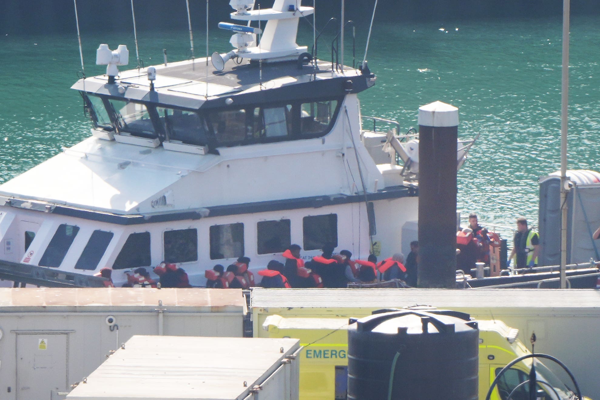 A group of people thought to be migrants are brought in to the Border Force compound in Dover, Kent, on Tuesday (Gareth Fuller/PA)