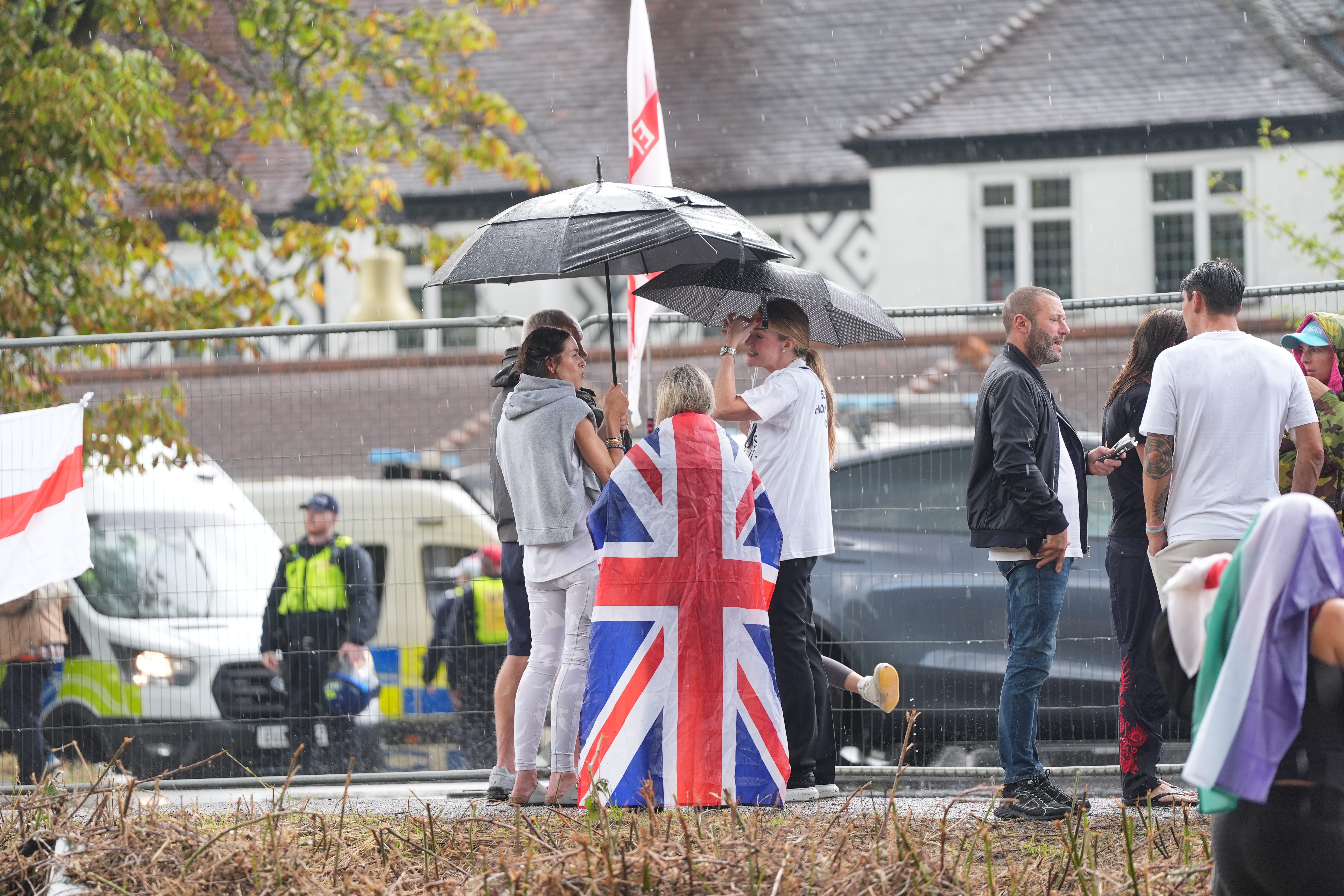Protesters outside the Bell Hotel in Epping in July (Yui Mok/PA)