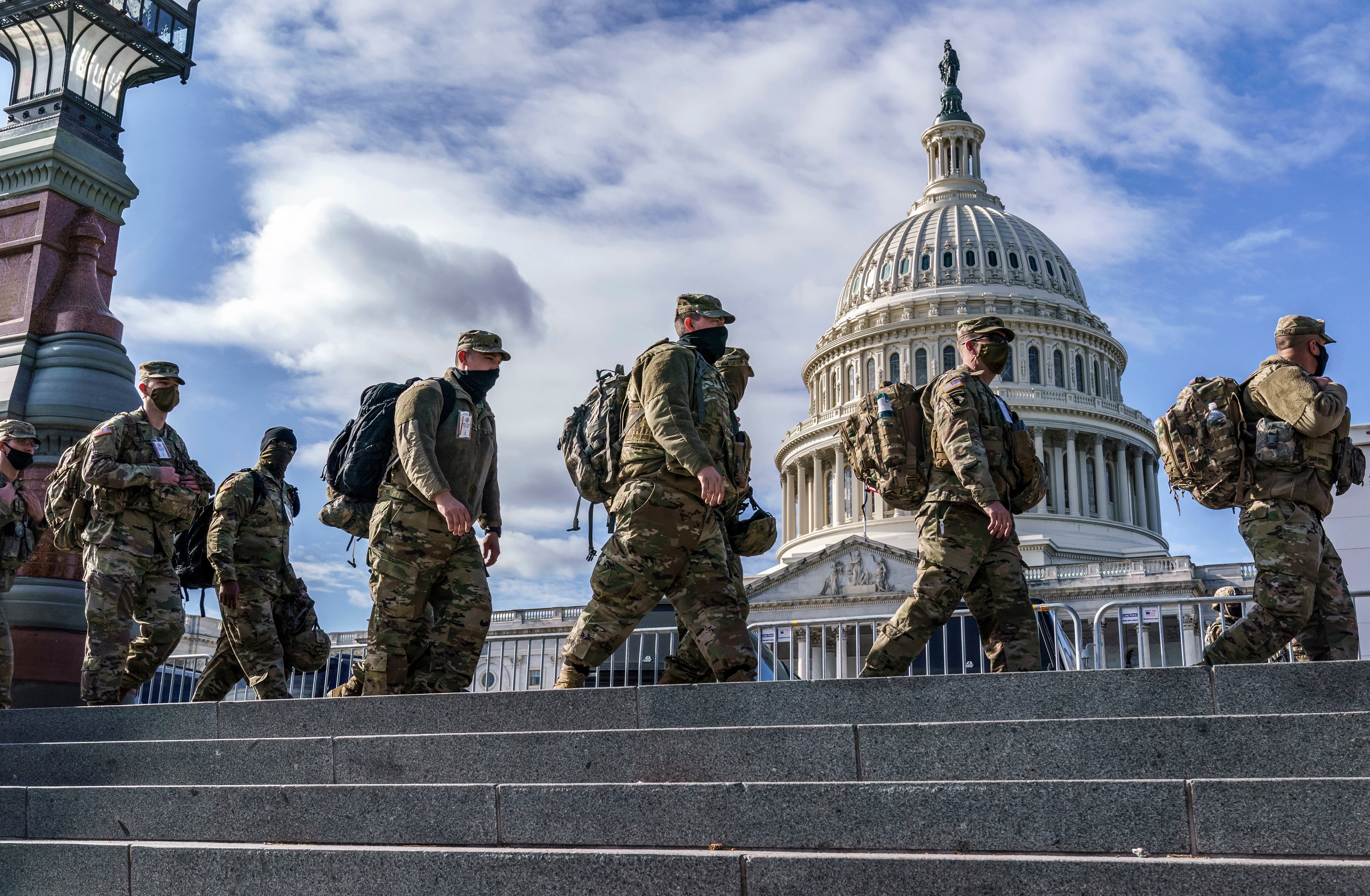 President Donald Trump is throwing the full weight of his administration behind a ‘rescue’ operation to free the city from its ‘out of control’ crime rate. Pictured: Troops at the Capitol before the inauguration of former President Joe Biden in 2021.