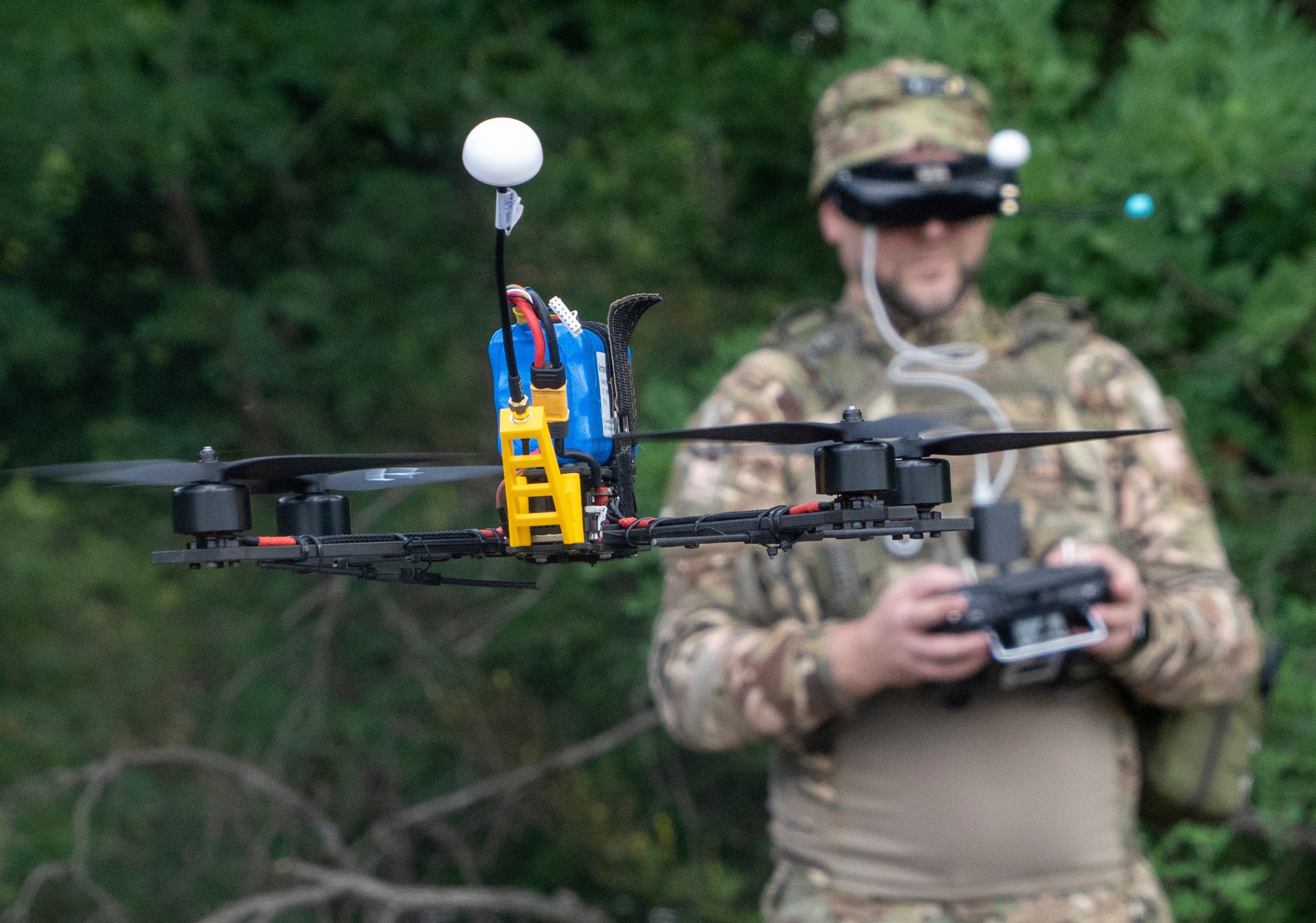A Ukrainian serviceman of 57th motorised brigade controls an FPV drone at the frontline in Kharkiv region, Ukraine