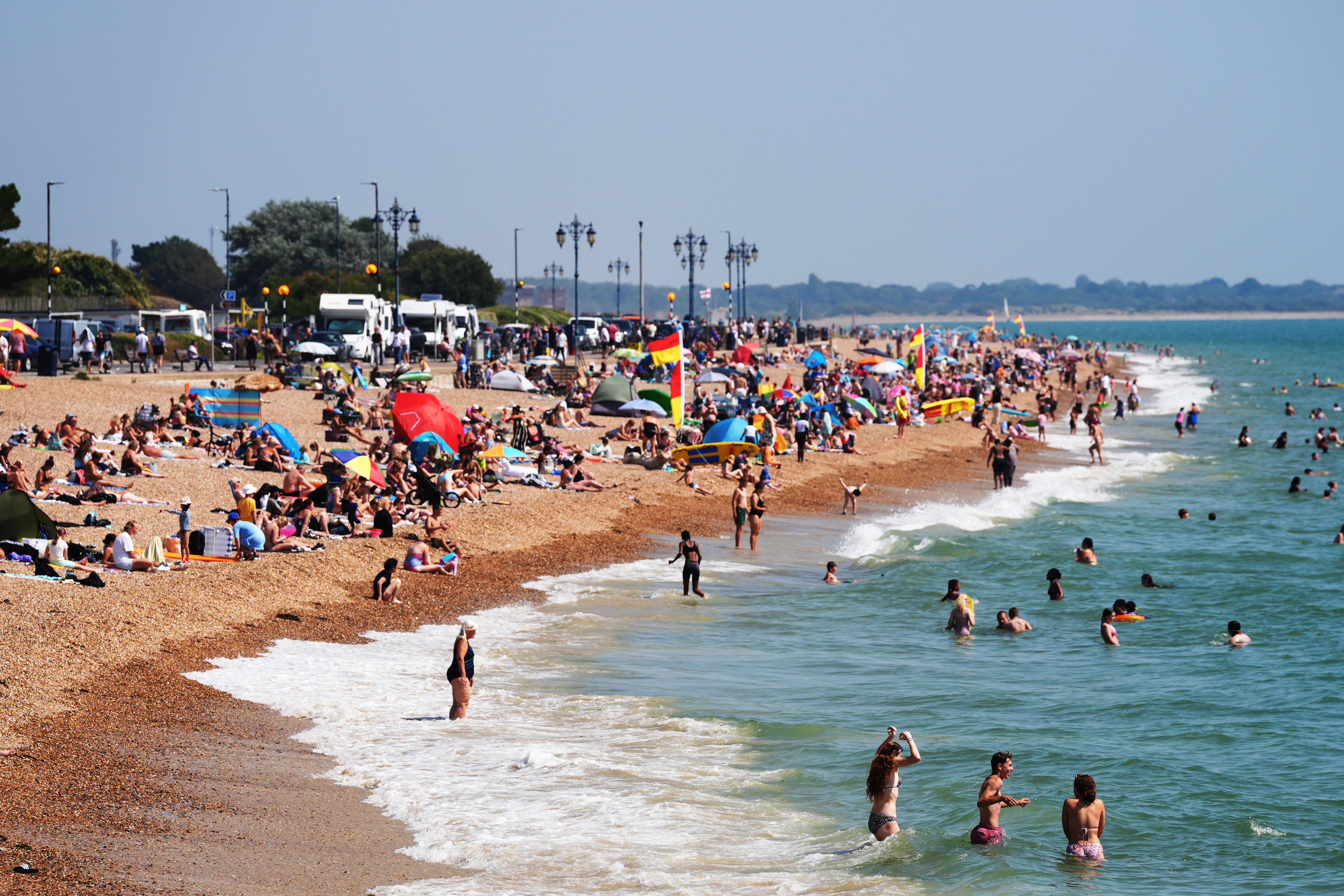 Visitors take to the shore on the seafront at Southsea, Hamphire (PA)