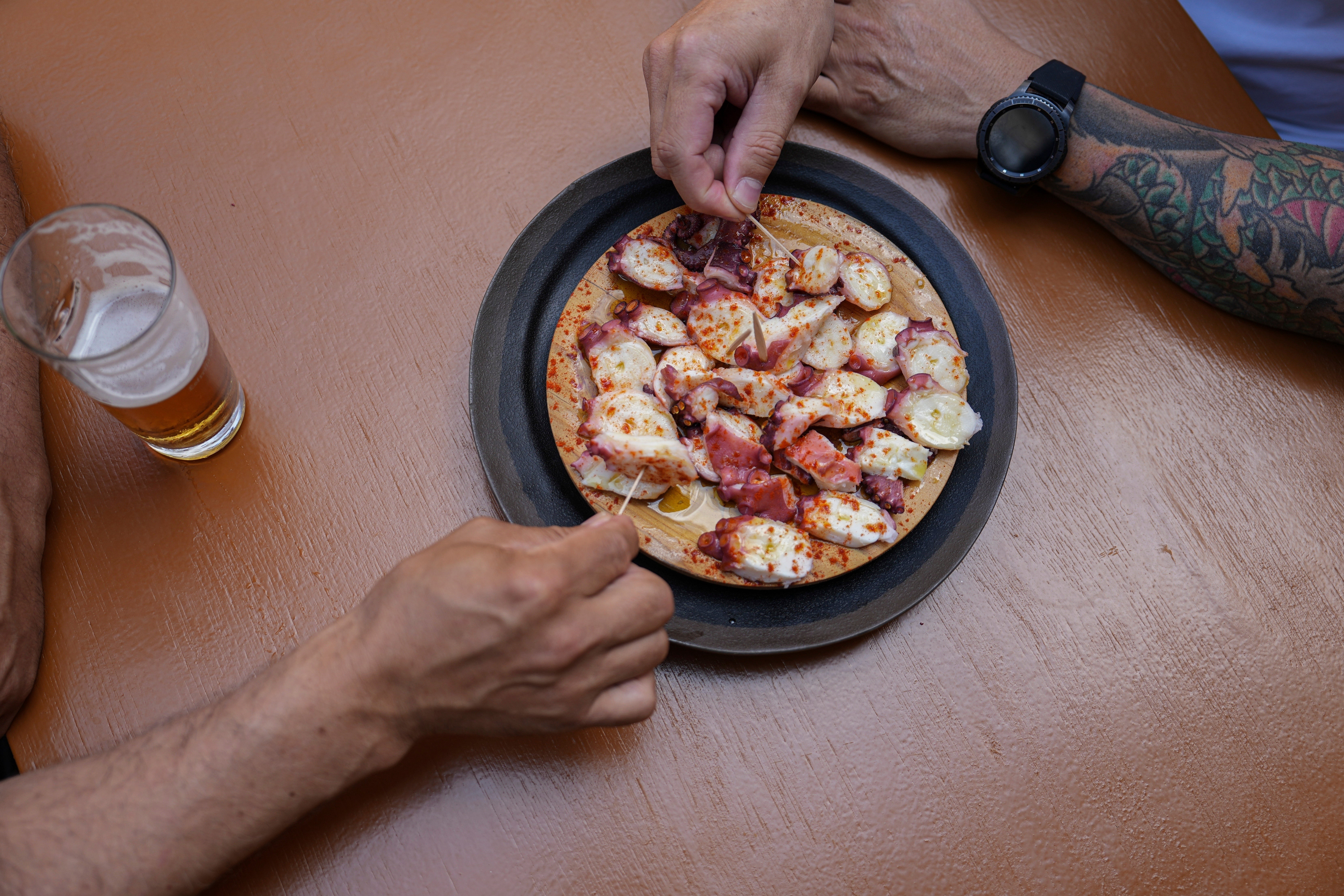 Diners snack on octopus, which is a popular dish at Casa Gazpara