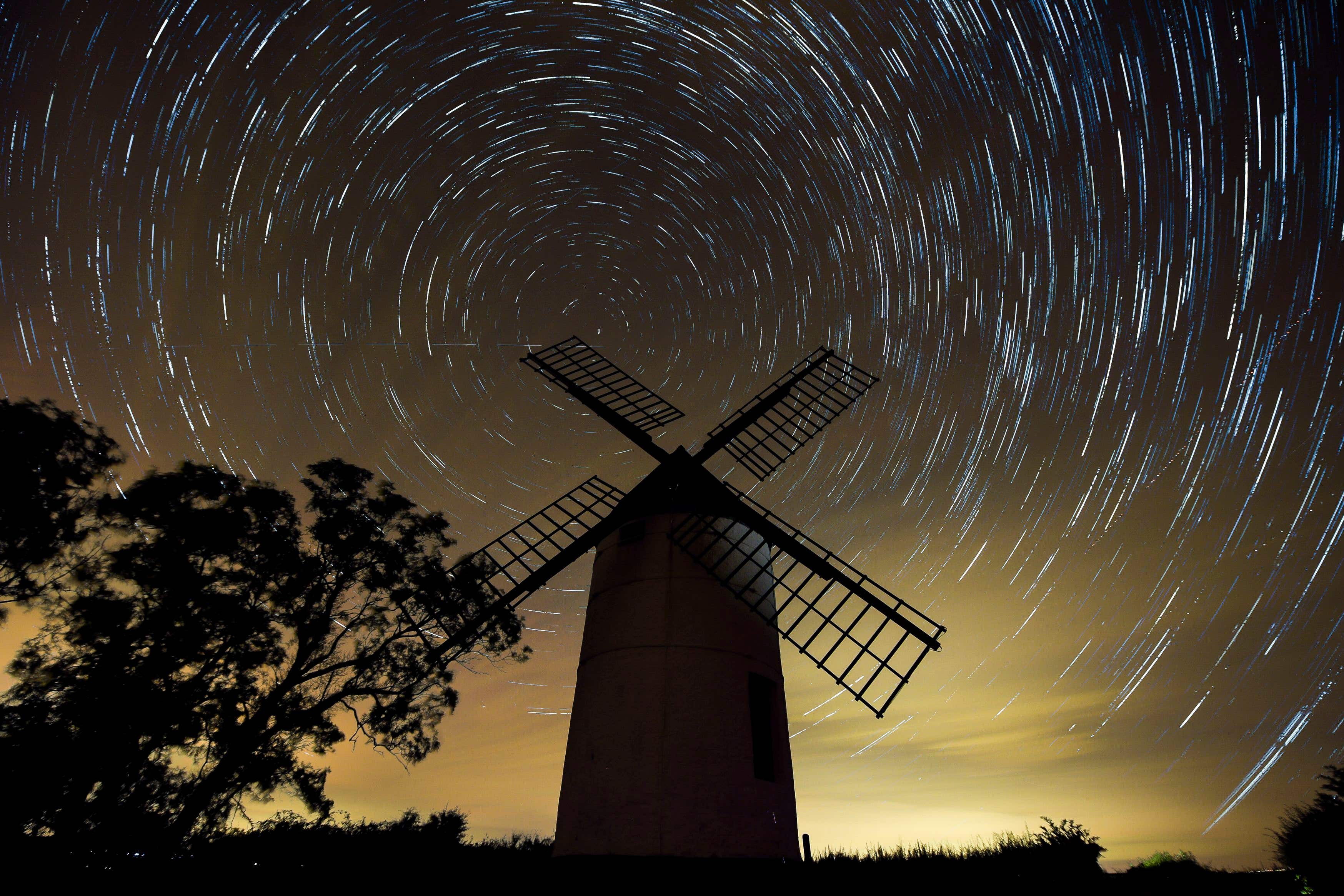 A composite image made from 726 photographs taken over three hours from midnight showing the rotation of the earth around Polaris, the North Star, in the night sky over Ashton Windmill, Somerset (Ben Birchall/PA)