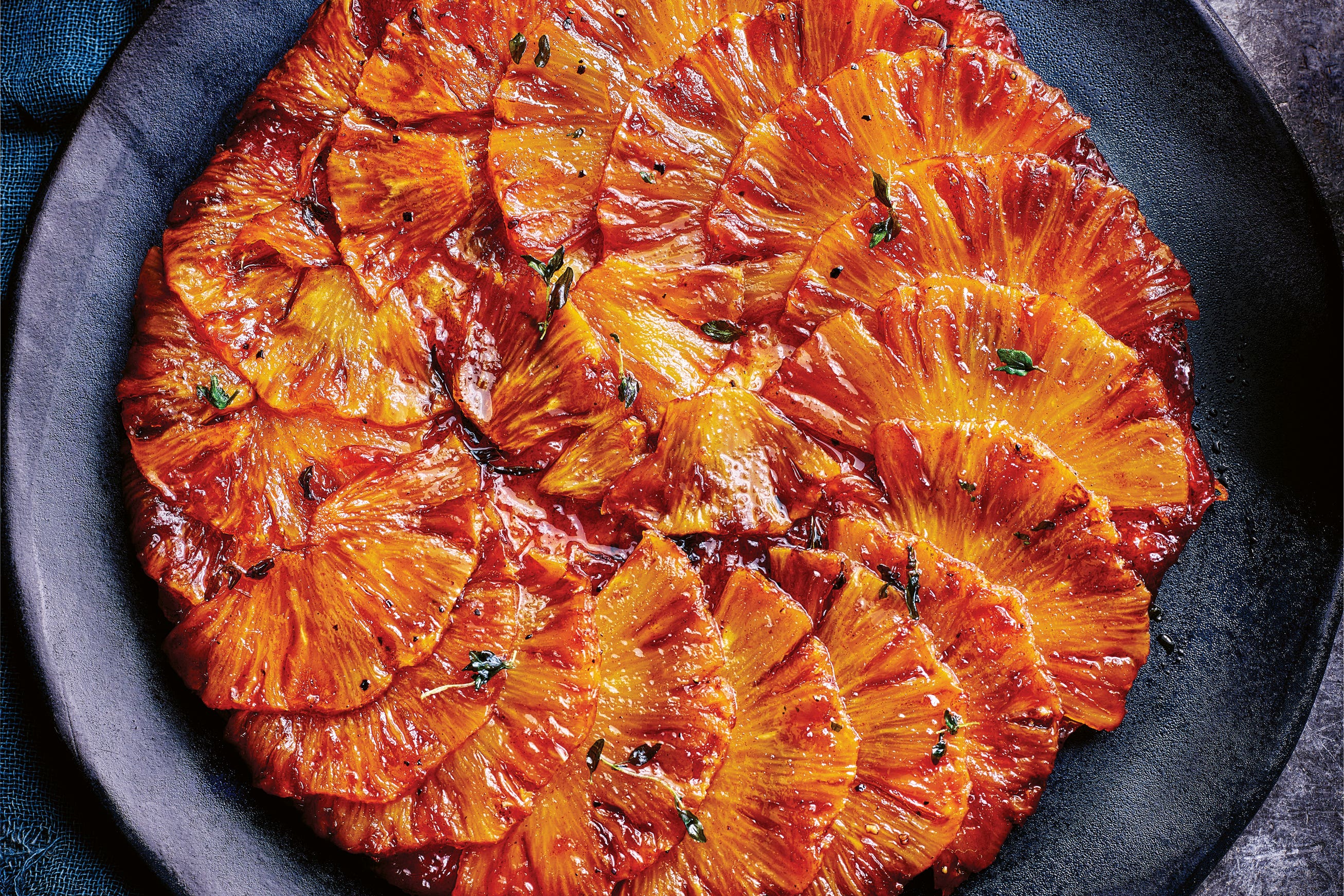 A glossy tarte tatin reimagined with pineapple, spice and thyme – a dessert that’s as striking as it is delicious