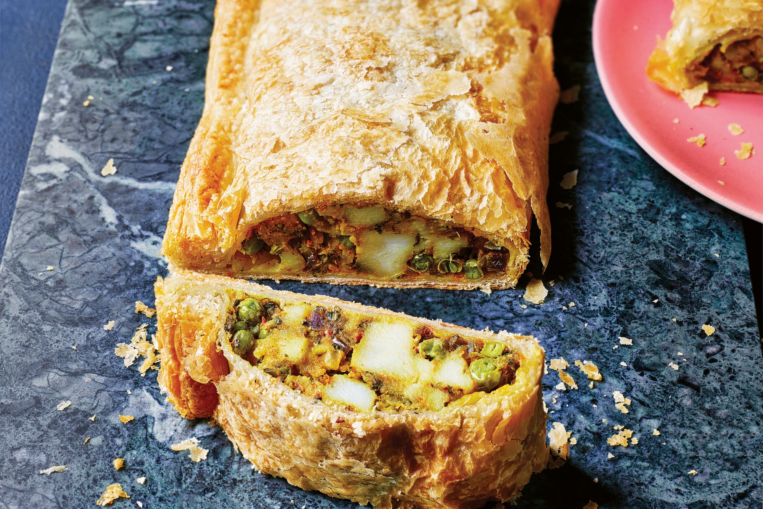 Golden puff pastry, spiced potato and peas – this vegetarian Wellington is as bold in flavour as it is in looks