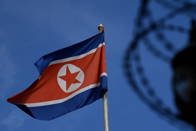 <p>The North Korean flag is seen at mast past the barbed wire fencing of the North Korean embassy in Kuala Lumpur on 27 March, 2017</p>