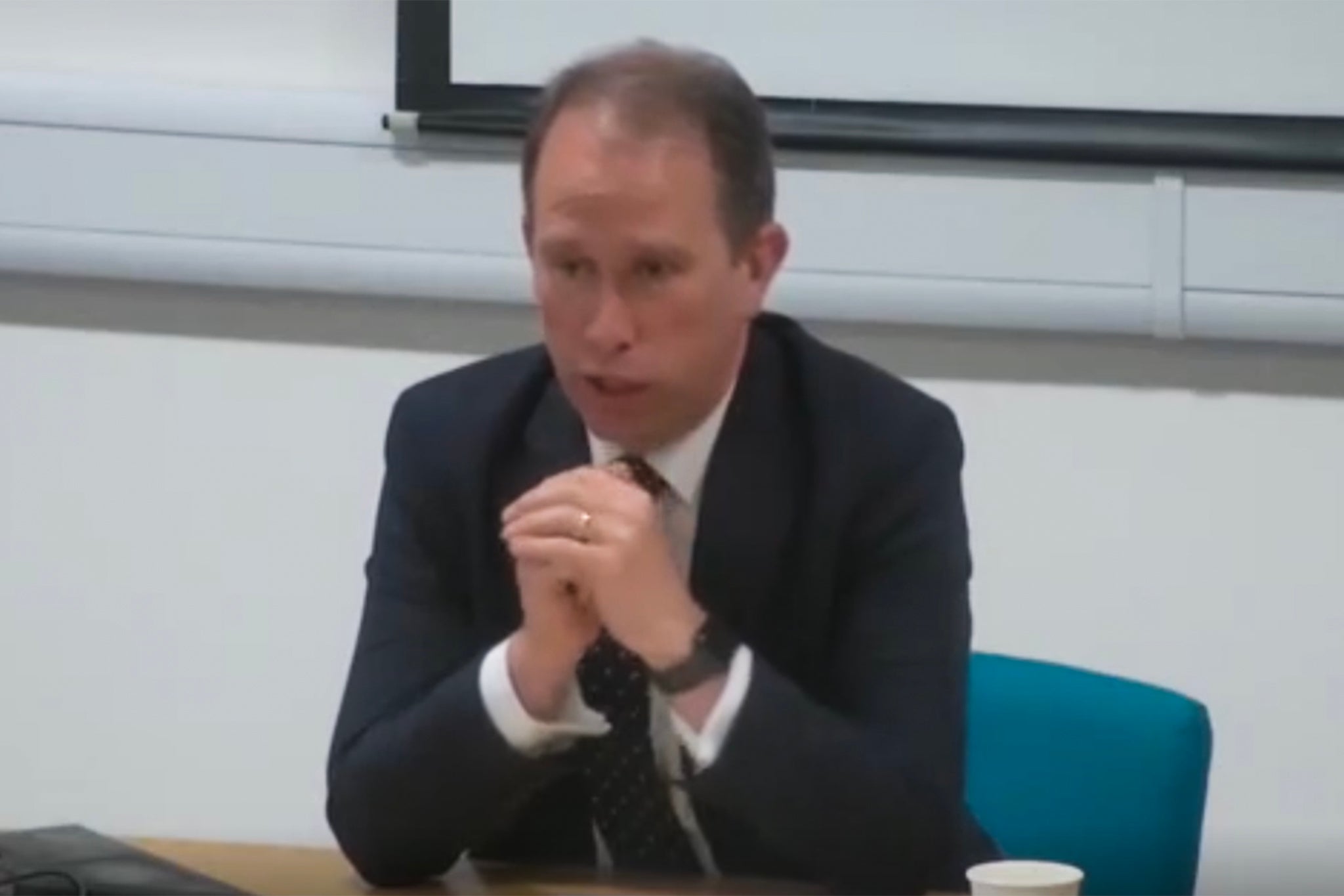 Matthew Barber, the Conservative Police and Crime Commissioner for Thames Valley, appears before a council meeting