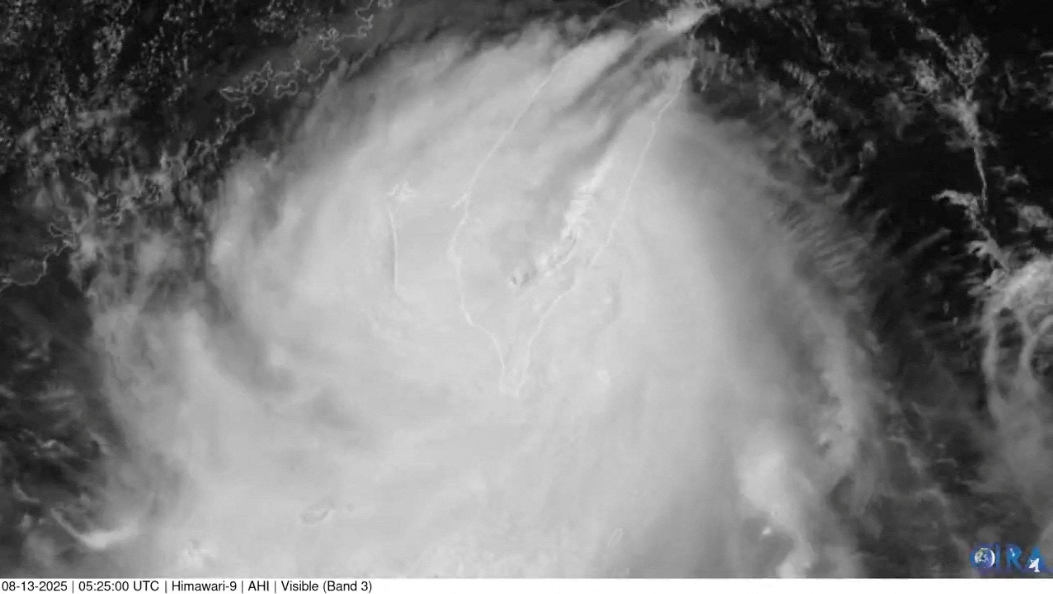 Satellite view shows Typhoon Podul blowing through Taiwan