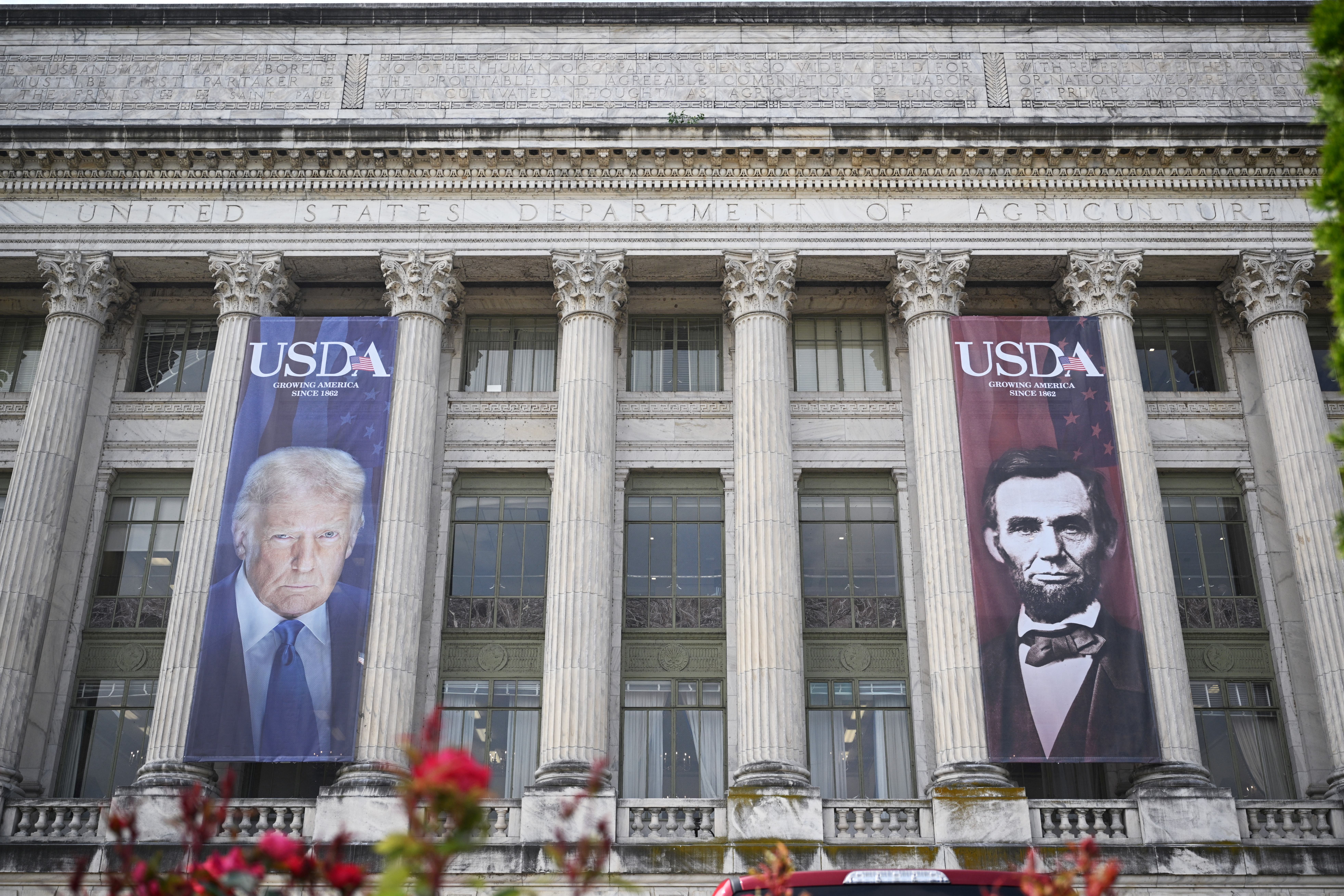 The banners of Trump and former President Abraham Lincoln were put up in May coinciding with the department’s 163rd anniversary