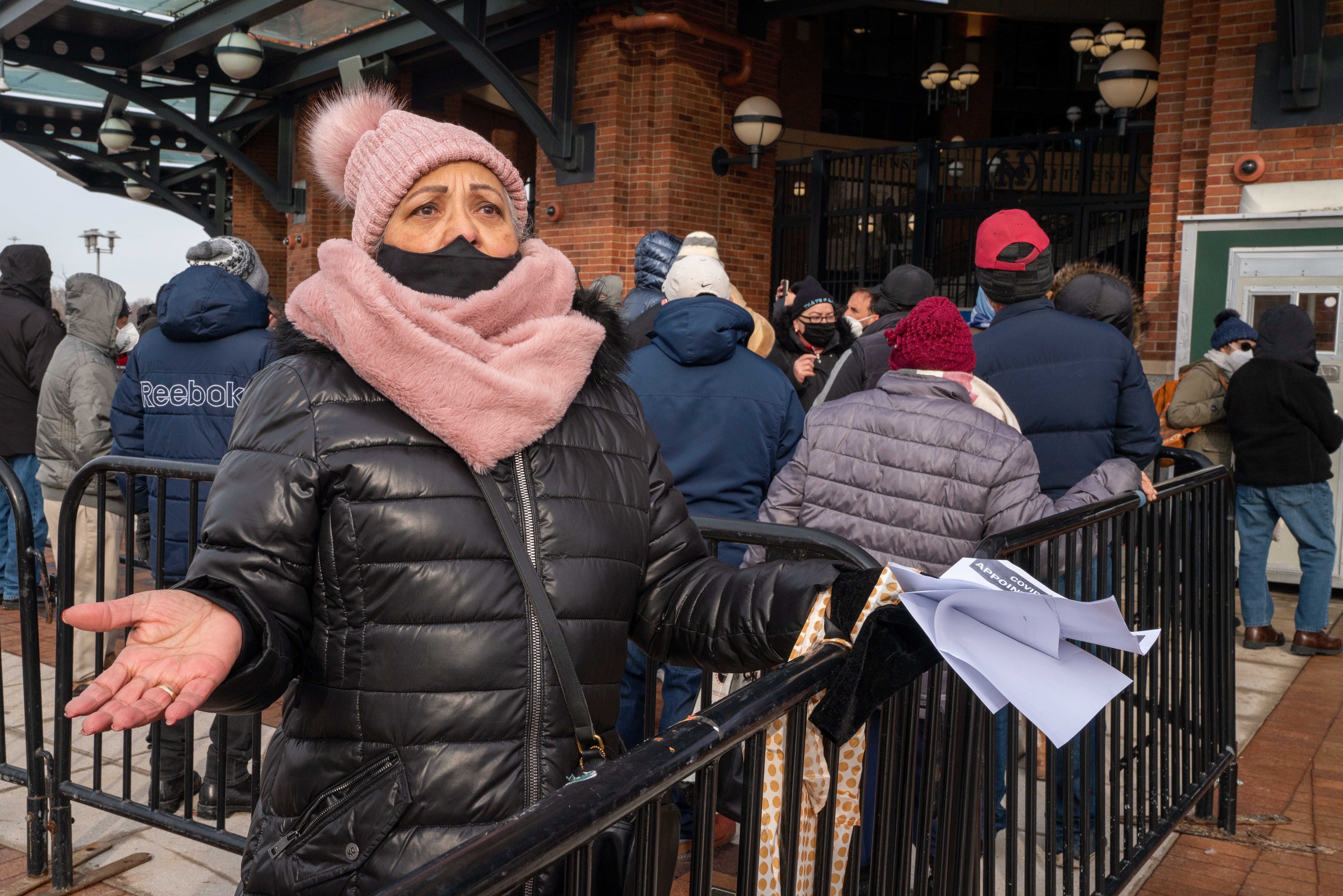 A frustrated person after waiting on line to enter a coronavirus (COVID-19) vaccination site at Citi Field is told she must make an appointment on February 10, 2021 in the Queens borough of New York City.
