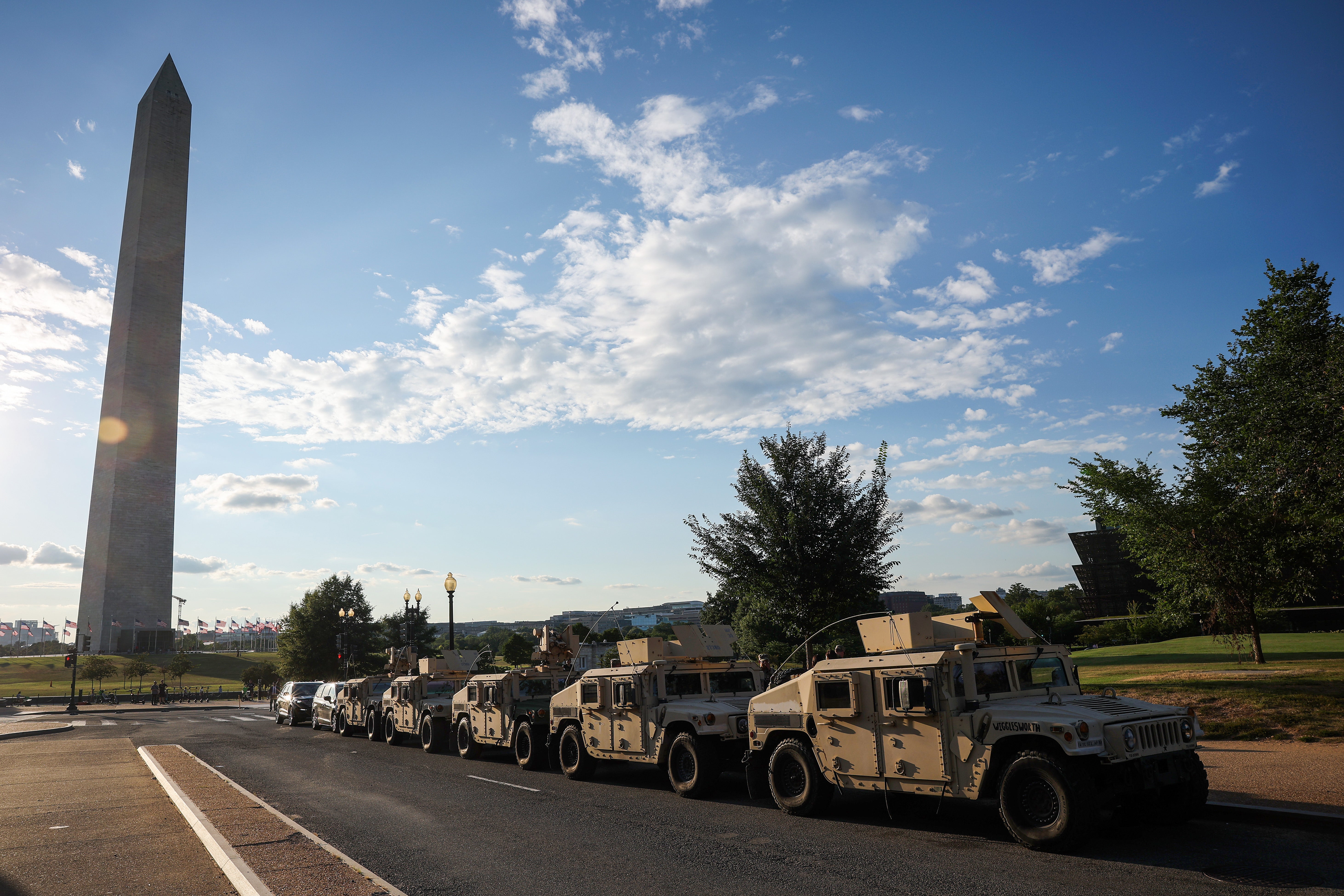 Military vehicles with the Washington, D.C. National Guard are parked near the Washington Monument amid the federal takeover