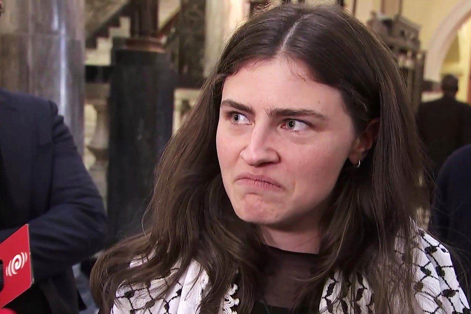 Chlöe Swarbrick talks to the media after she was thrown out of Parliament