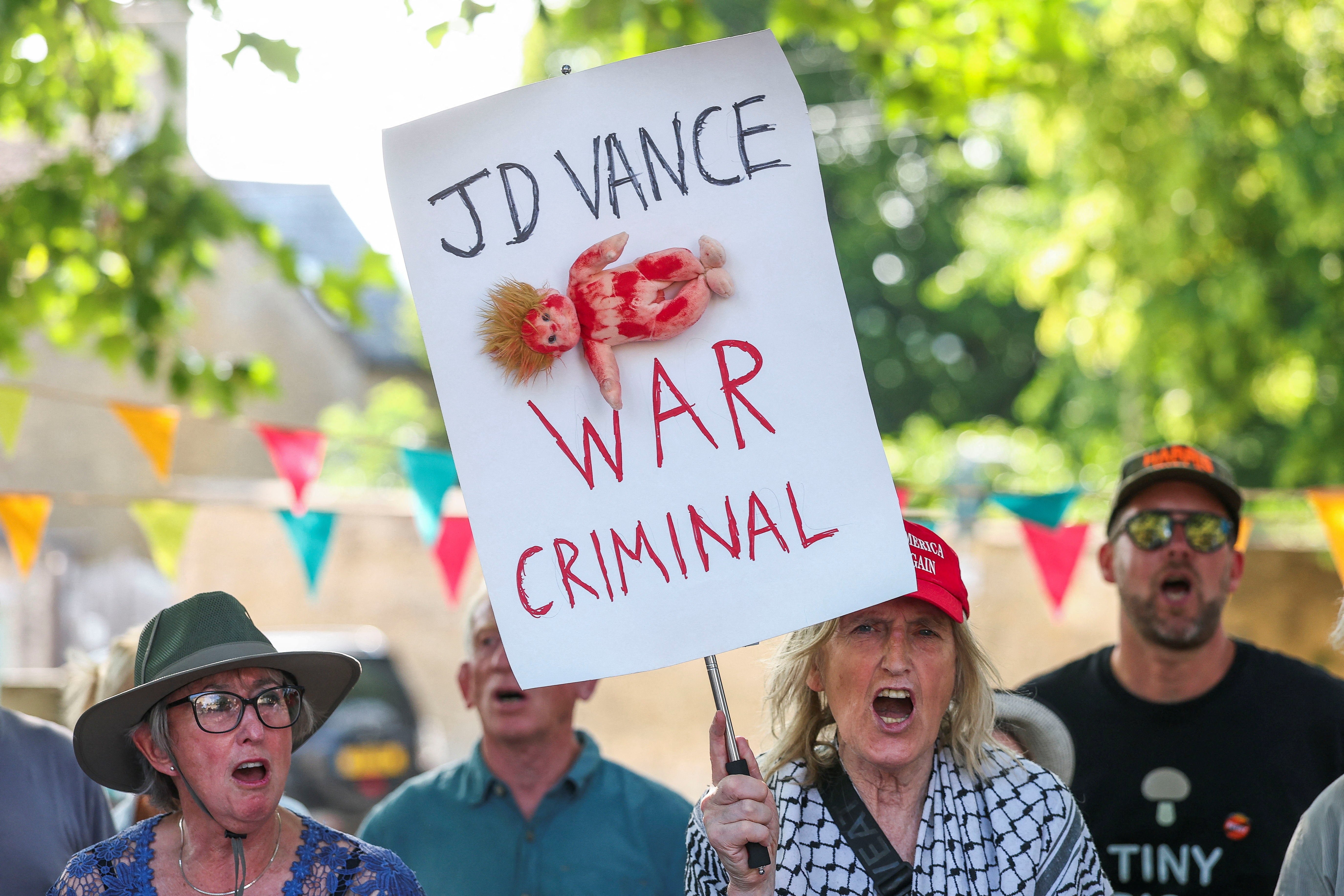 A number of protesters referenced the US government’s support for Israel amid the starvation and bombardment of Gaza, with several placards reading ‘end the genocide’ and calling the vice president a ‘war criminal’