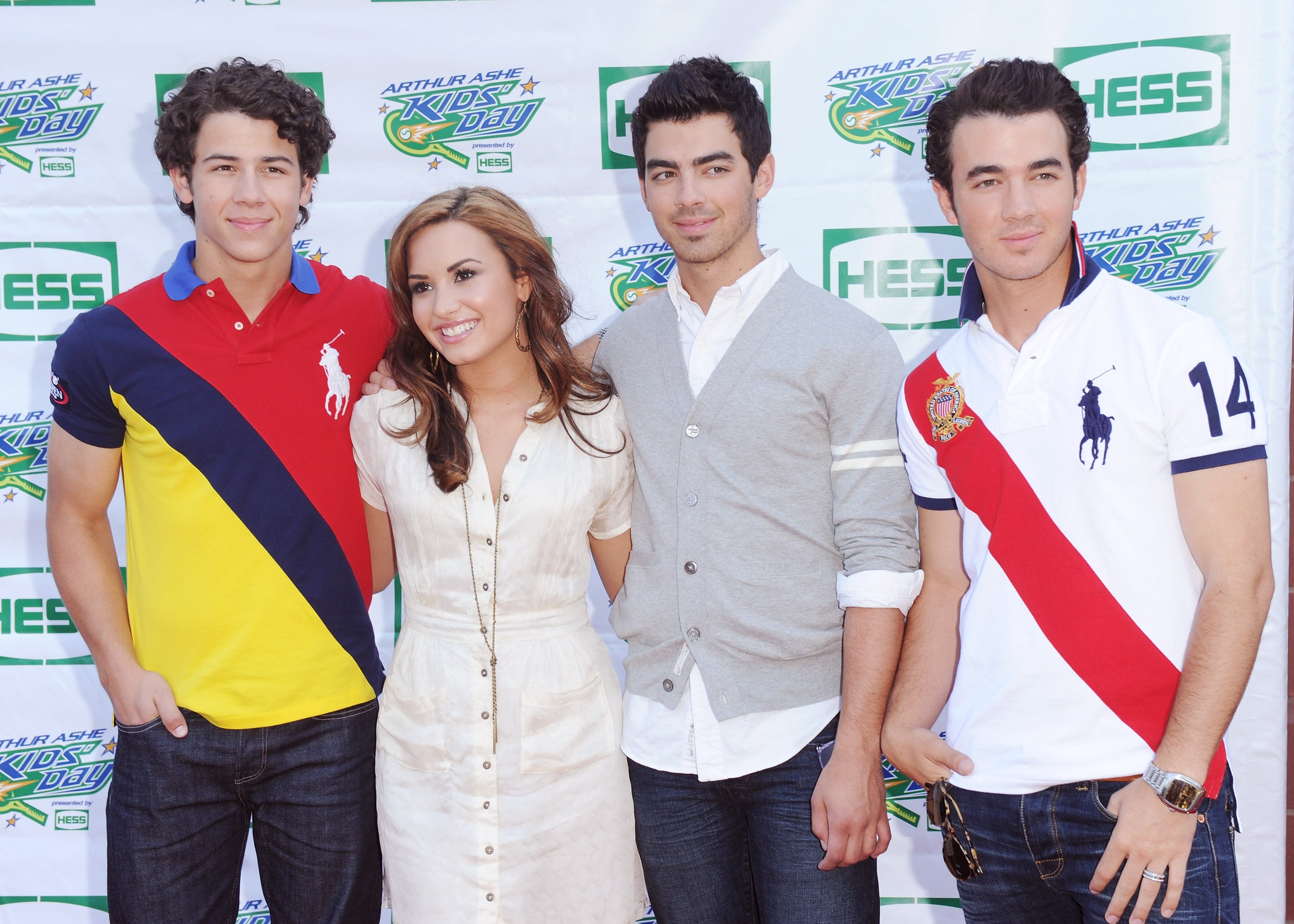 Demi Lovato with the Jonas Brothers, L-R Nick, Joe and Kevin, in 2010