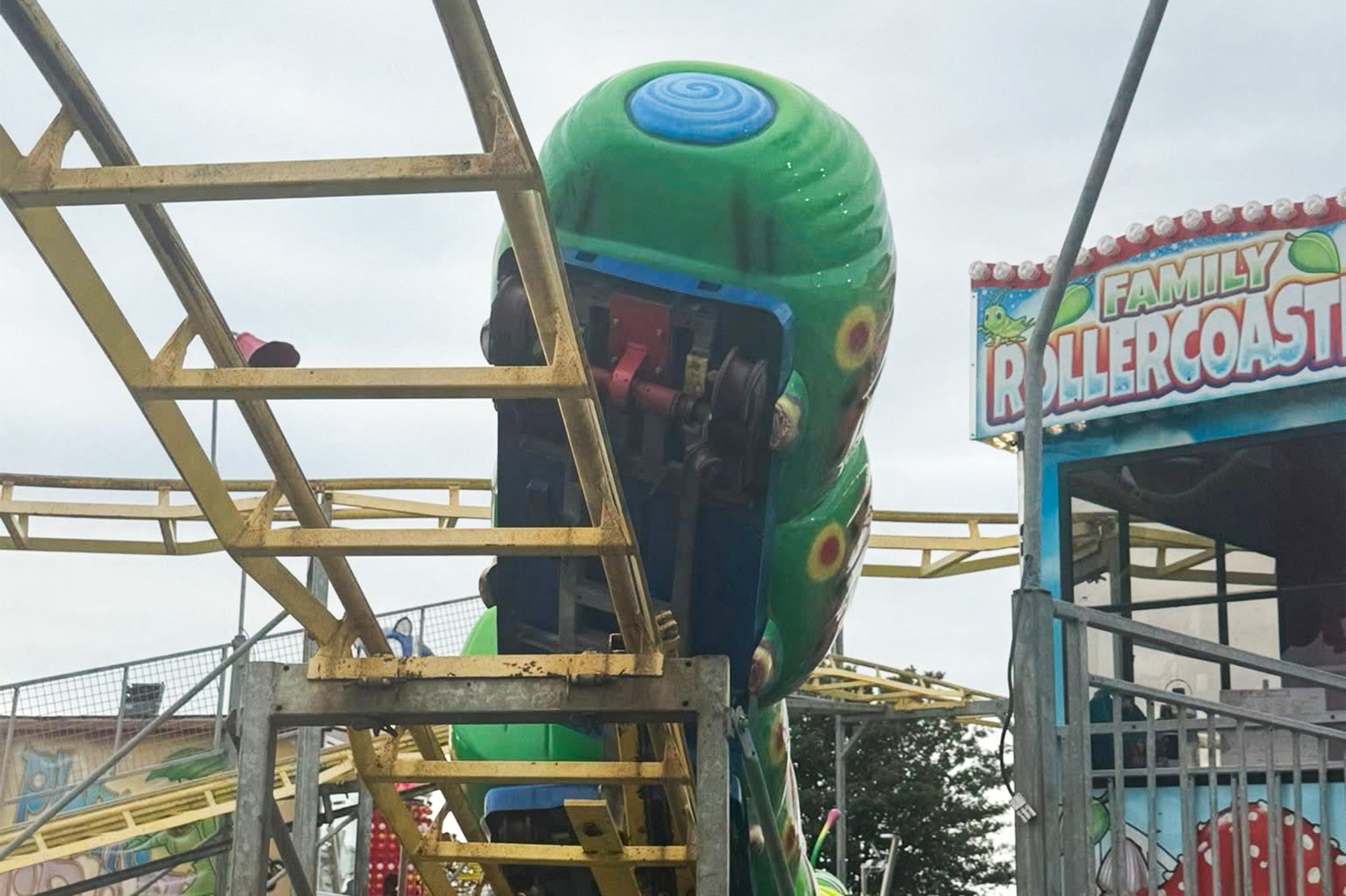 The derailed Wacky Worm ride at Coney Beach, Porthcawl