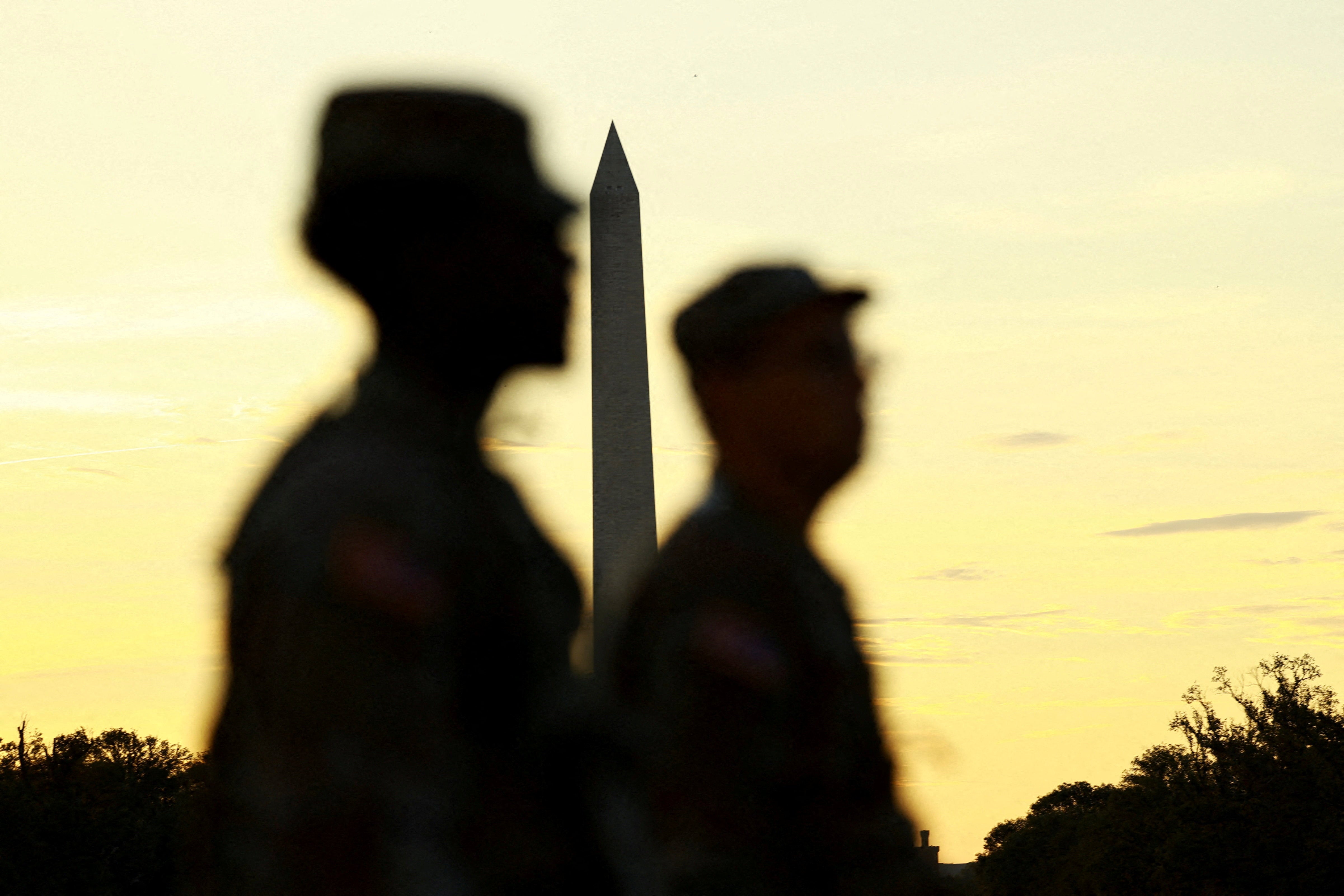 U.S. military members patrol near the Washington Monument in D.C. on Thursday August 14 2025