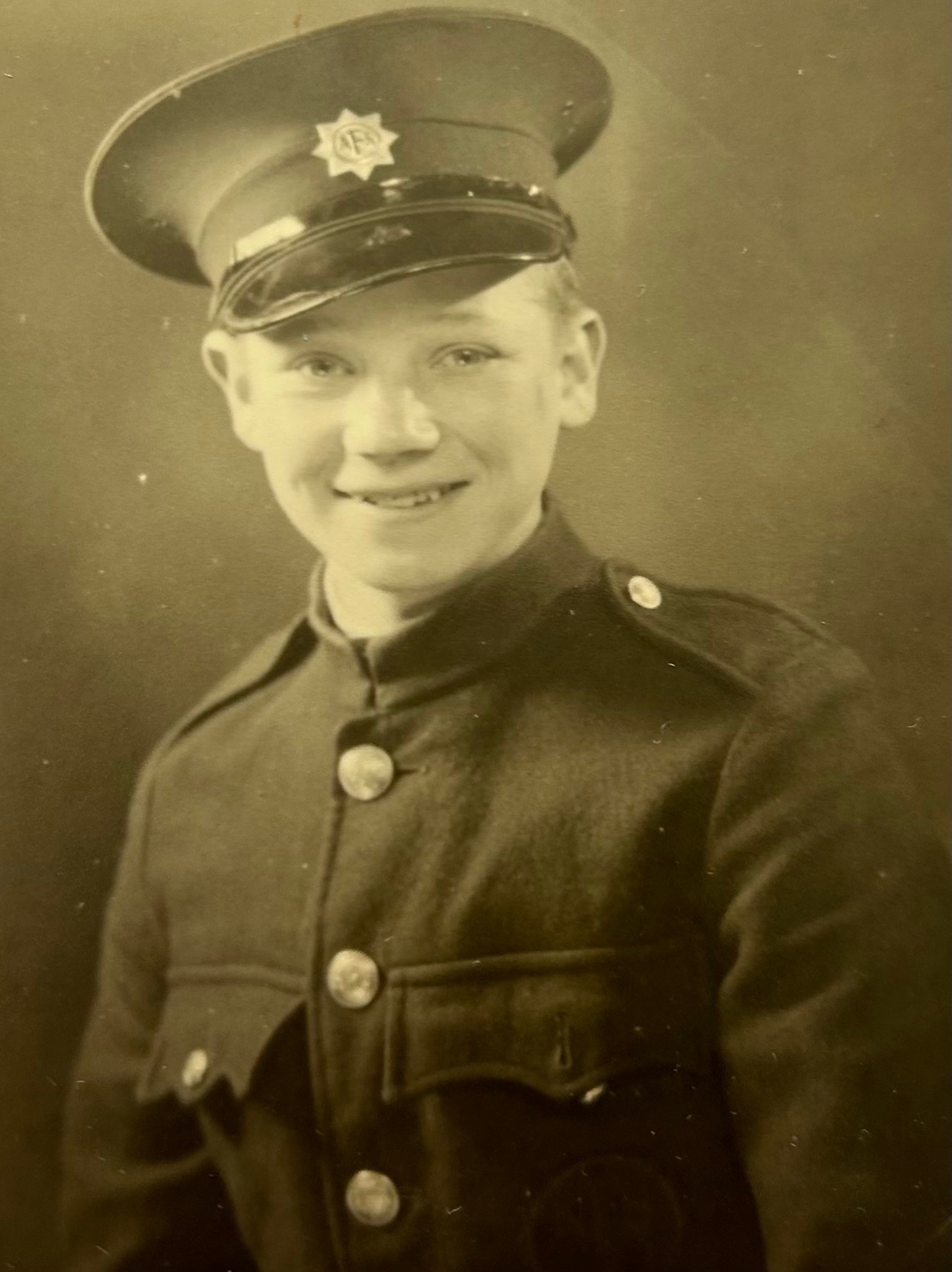 Draper, pictured in 1942 when he was a messenger boy for the fire service.