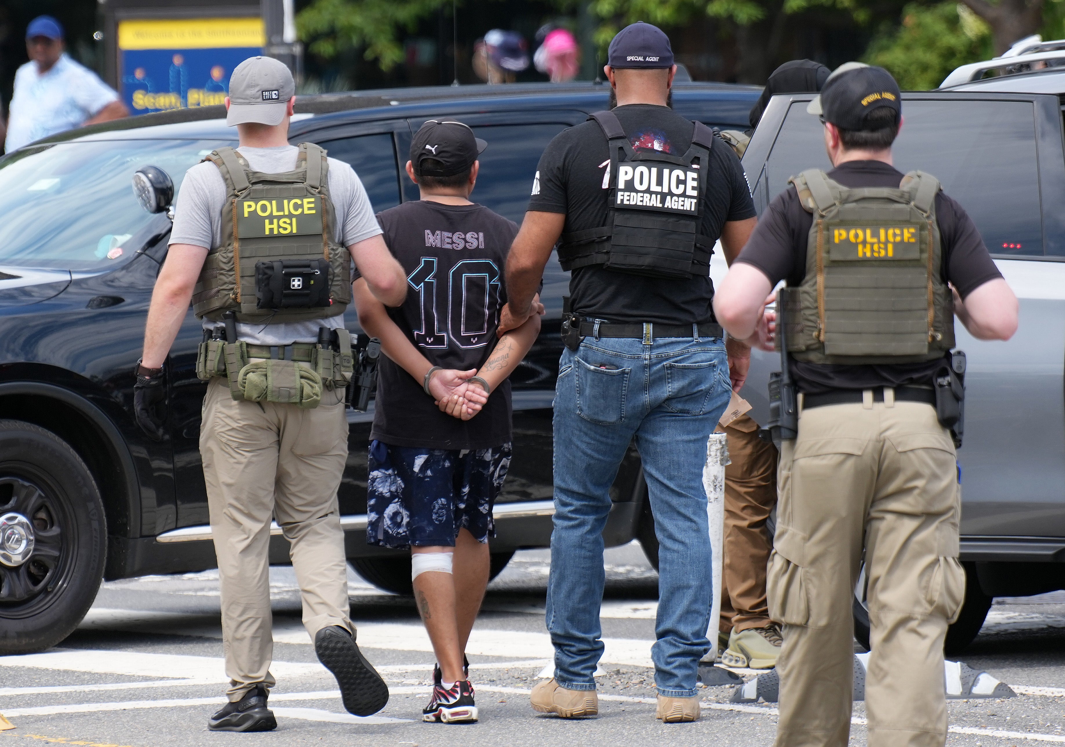 Homeland Security Investigations officers detain a person on the National Mall in Washington, D.C., on Tuesday