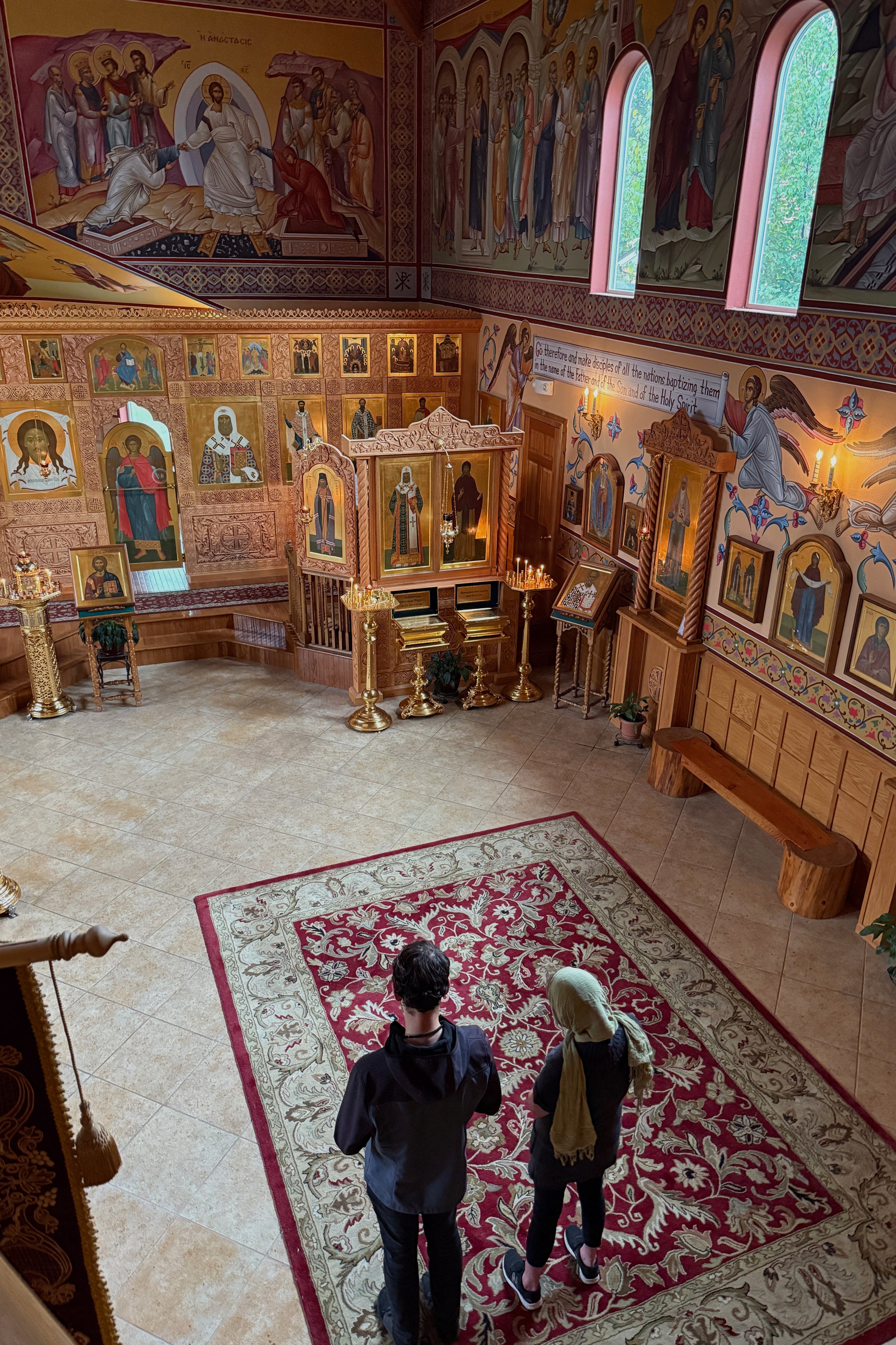 Two parishioners pray at St. Tikhon Orthodox Church in Anchorage during an Akathist service dedicated to peace in Ukraine