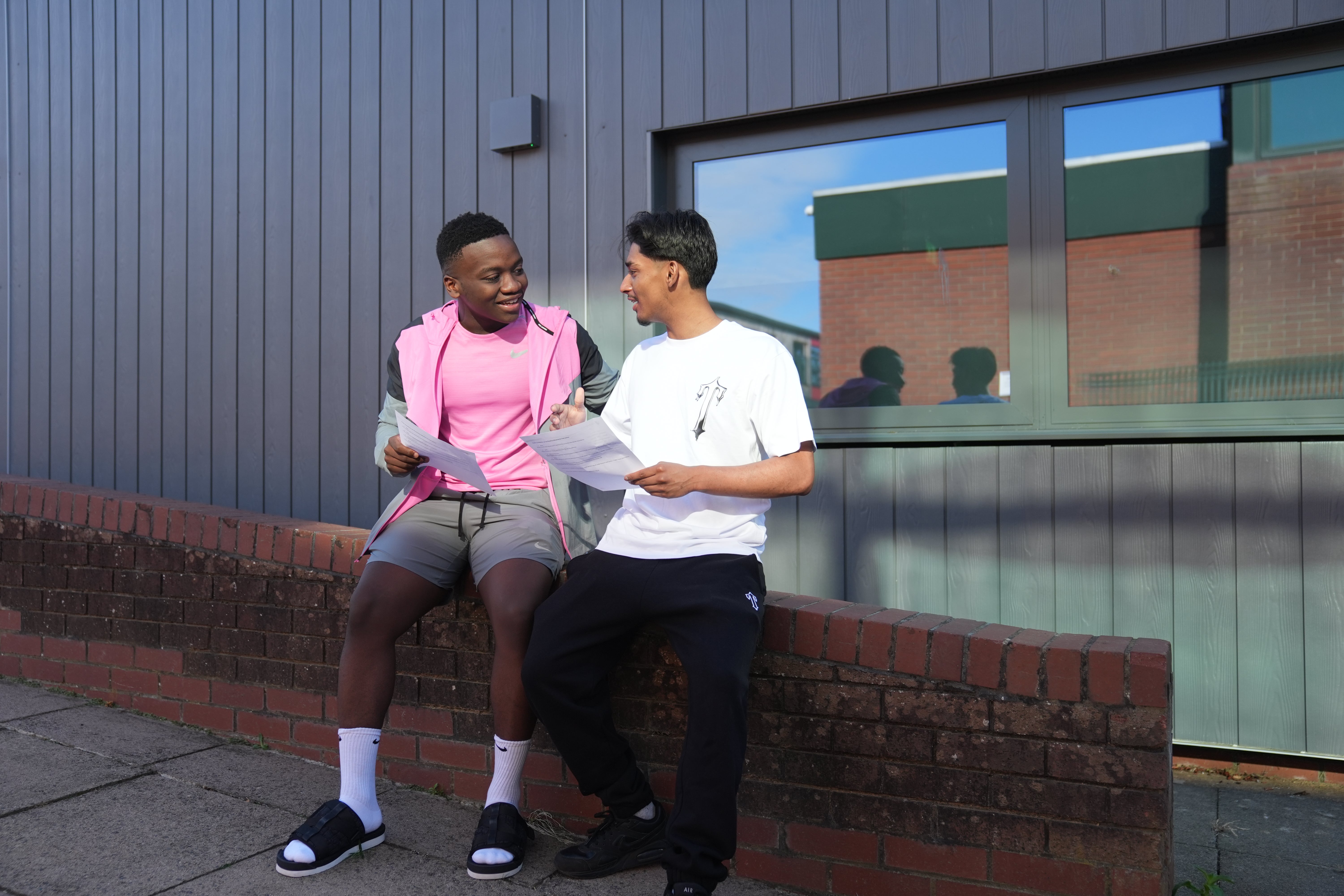 Mazvita Hlubanyana (left) and Akif Ghany receive their A-level results at Latimer Arts College in Barton Seagrave, Northamptonshire, on Thursday