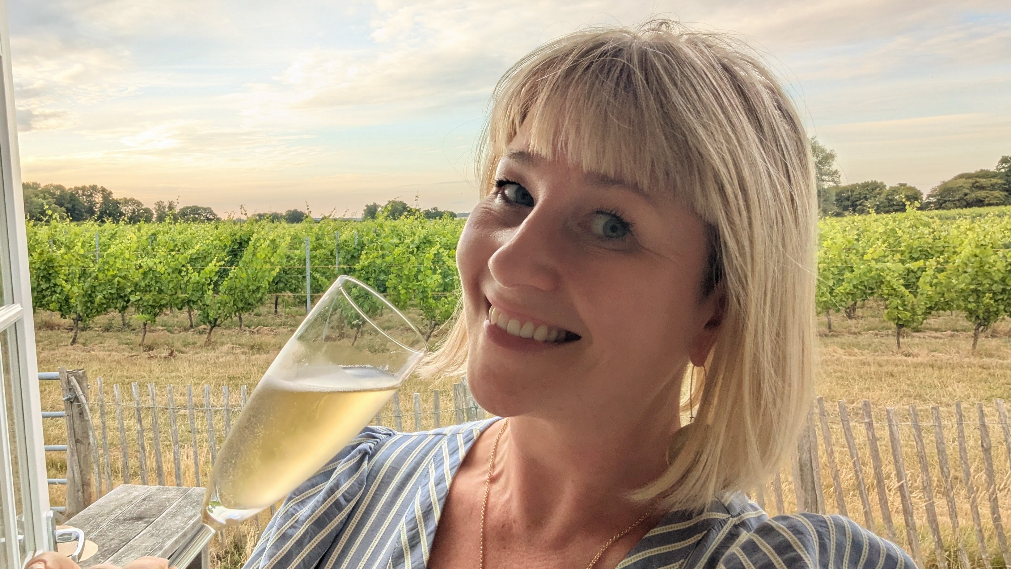 Writer Rosamund Hall enjoys a glass of English sparkling wine at a vineyard in Sussex