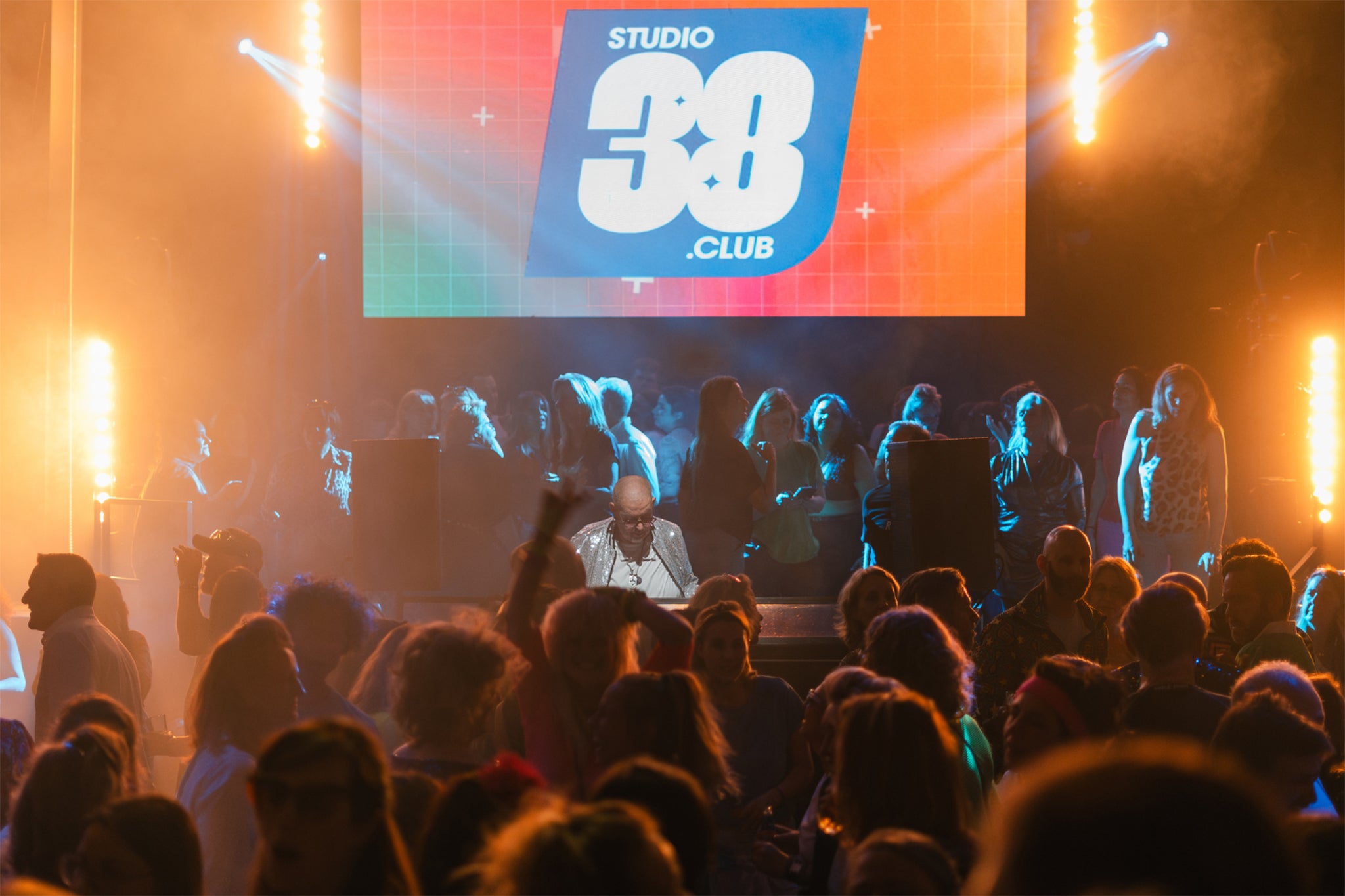 Partygoers at a Studio38.Club daytime rave event, featuring Eighties and Nineties club classics