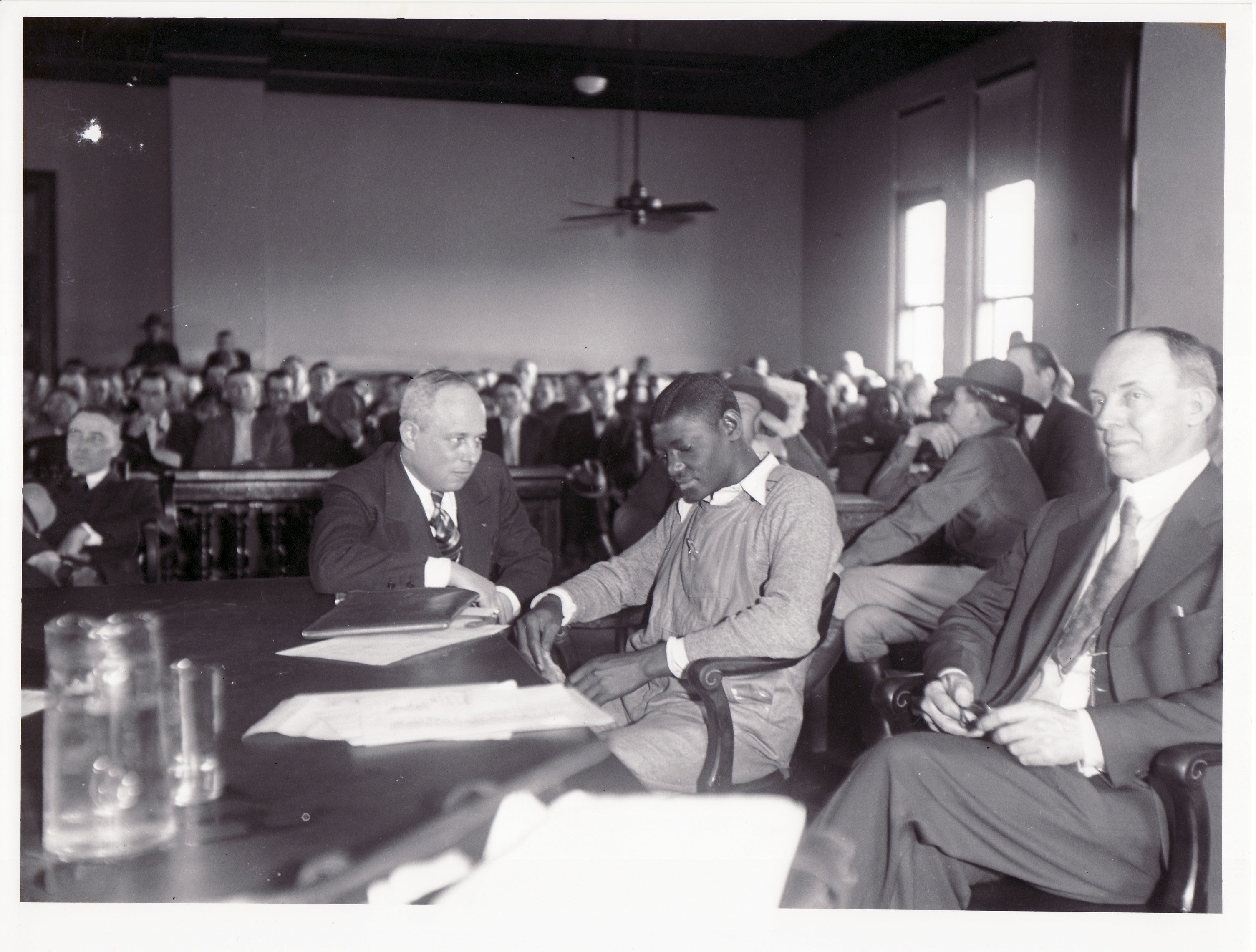 Haywood Patterson flanked by attorneys Samuel Liebowitz (L) and George Chamlee (R) in March 1933