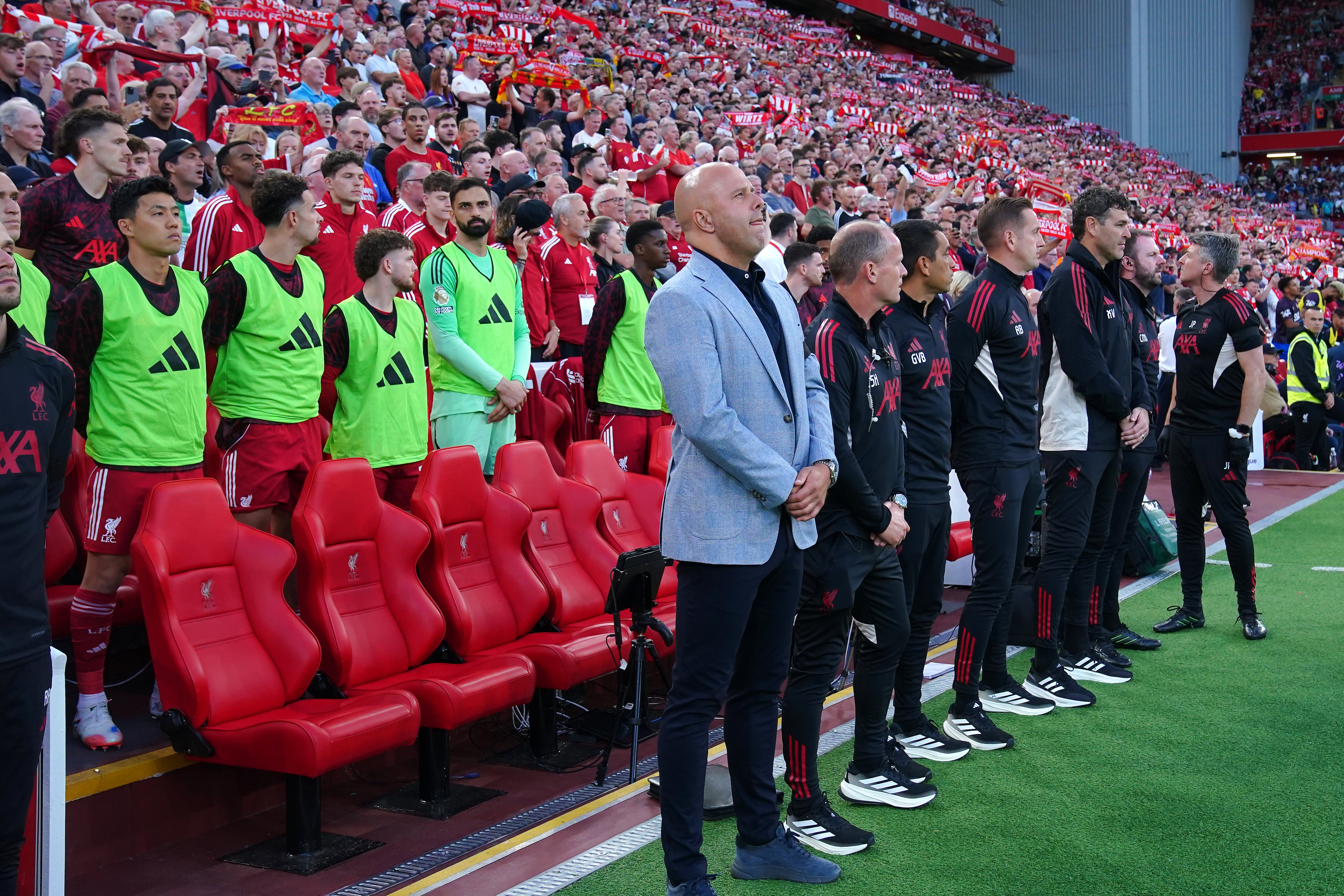 Liverpool manager Arne Slot (centre) stood during a minute’s silence in memory of Diogo Jota (Peter Byrne/PA)