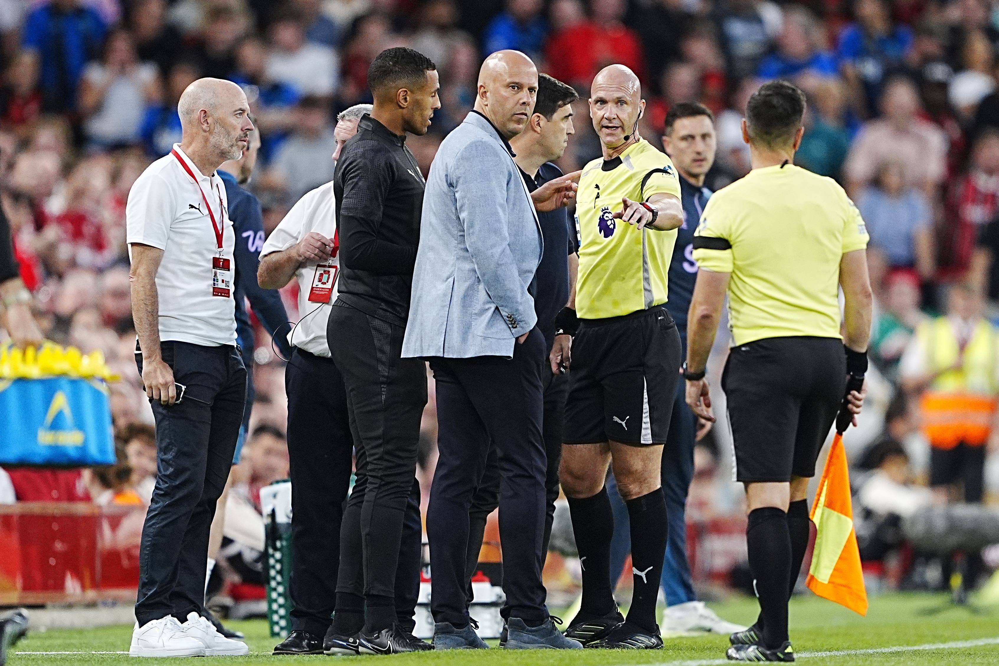 Referee Anthony Taylor (right) halted the game after the alleged incident (PA)