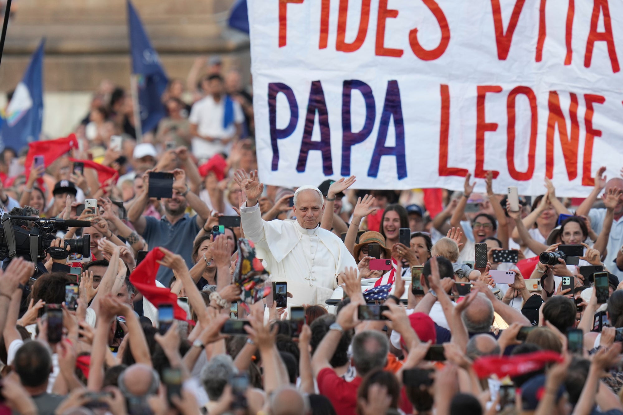 Pope Leo XIV waves as he arrives to hold a Pentecost vigil in St. Peter's Square at The Vatican, Saturday, June 8, 2025. (AP Photo/Alessandra Tarantino, File)
