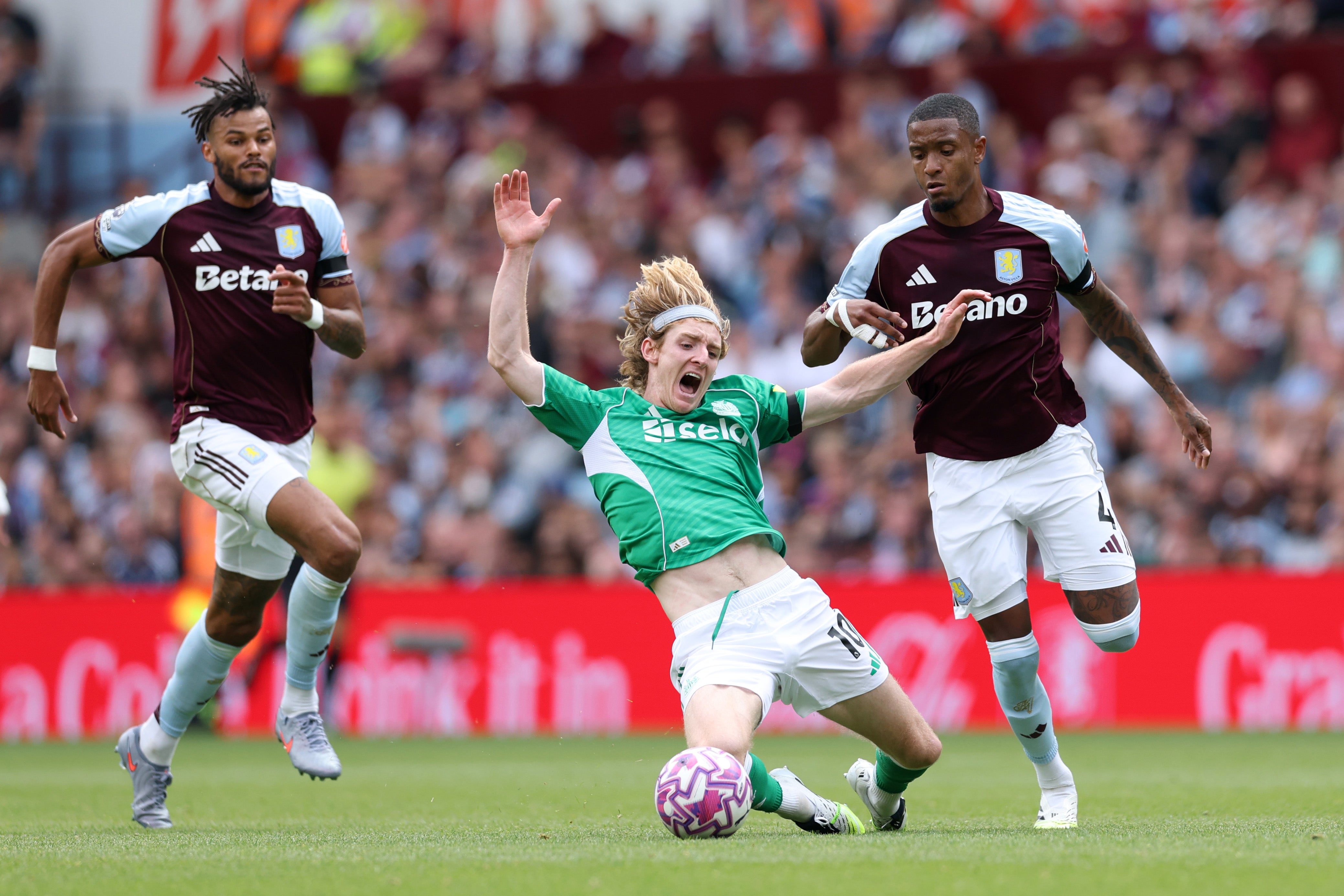 Anthony Gordon is knocked down by Ezri Konsa