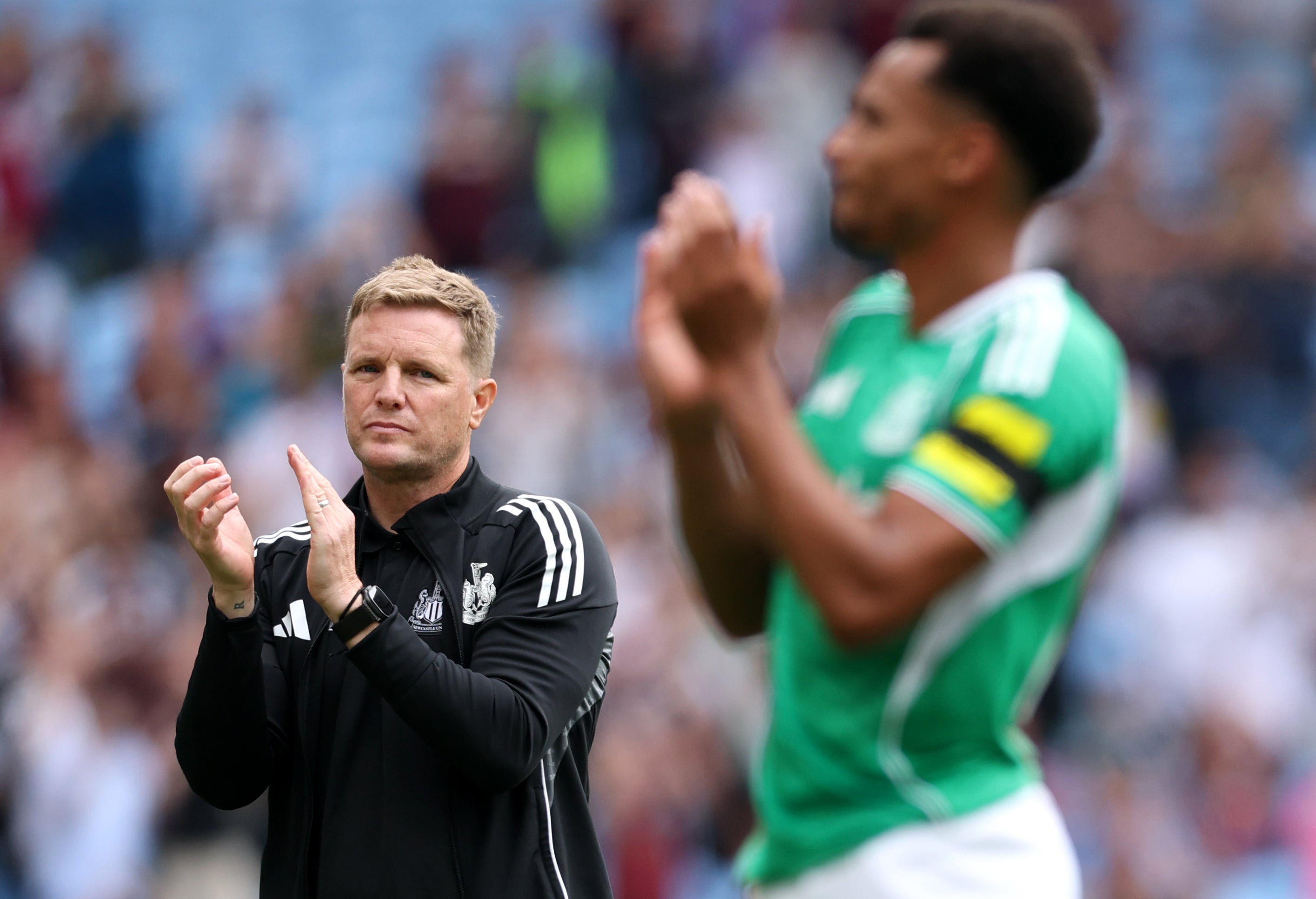 Eddie Howe applauds the visiting fans at full time