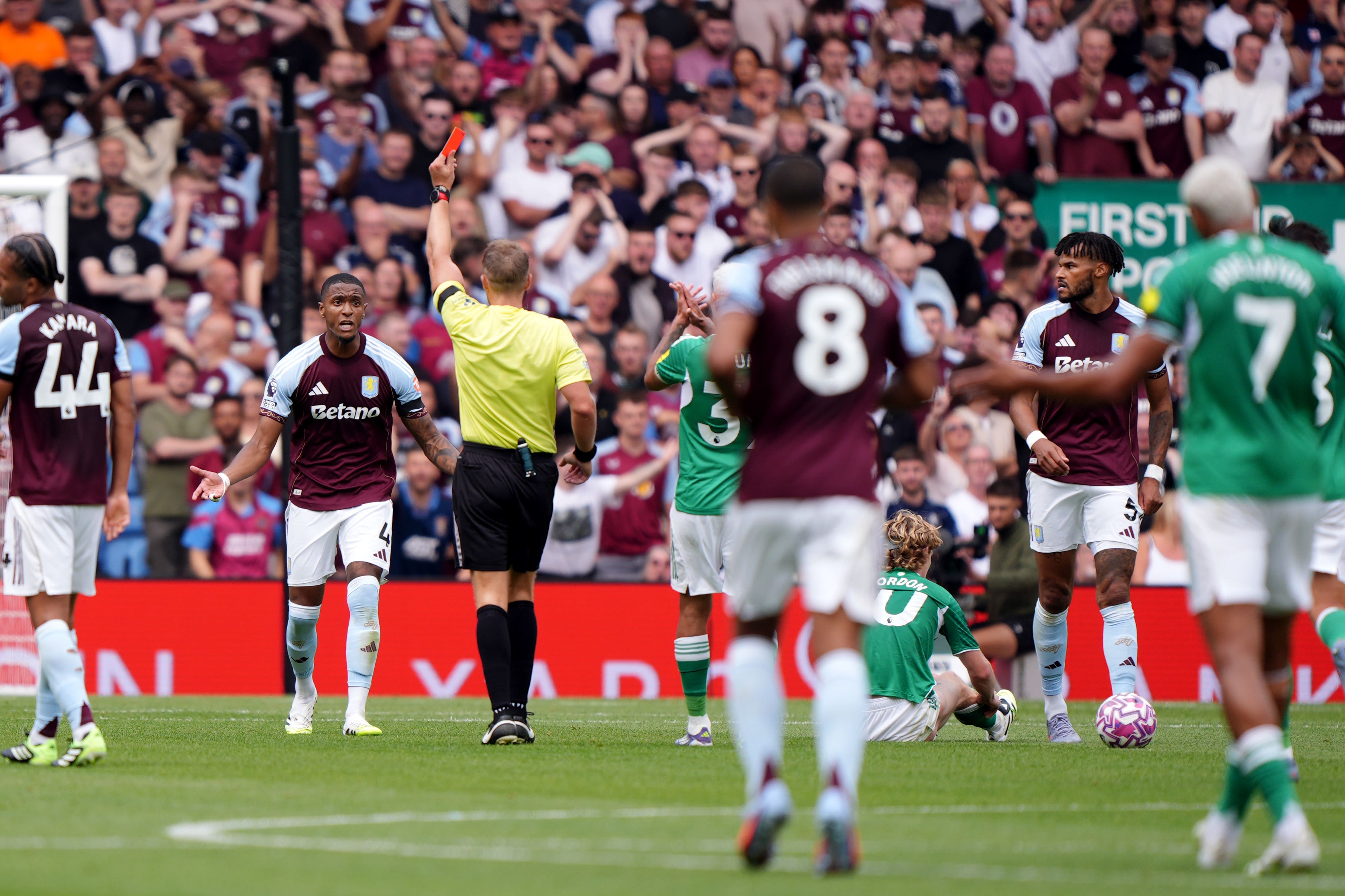 Aston Villa had Ezri Konsa sent off but still held Newcastle to a goalless draw (Bradley Collyer/PA).