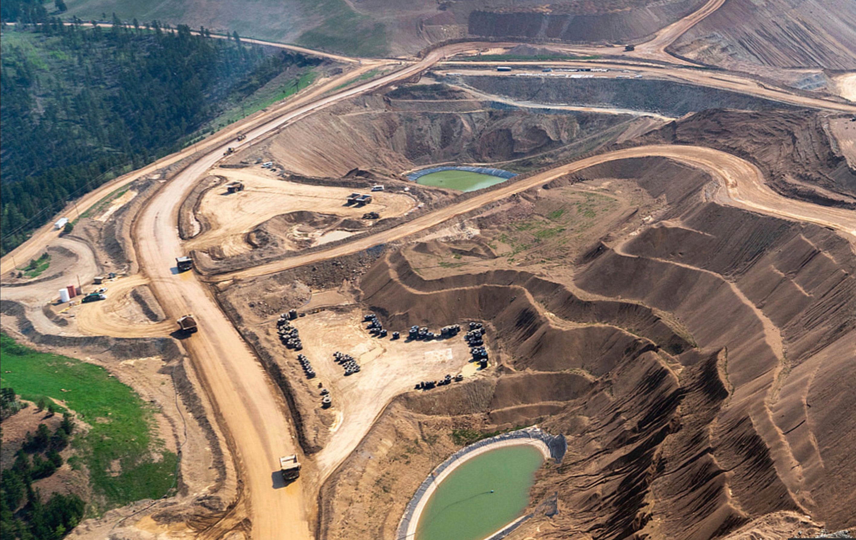 This image provided by EcoFlight shows an aerial view of the terraced structure of the Wharf gold mine in the Black Hills on Tuesday, May 23, 2023