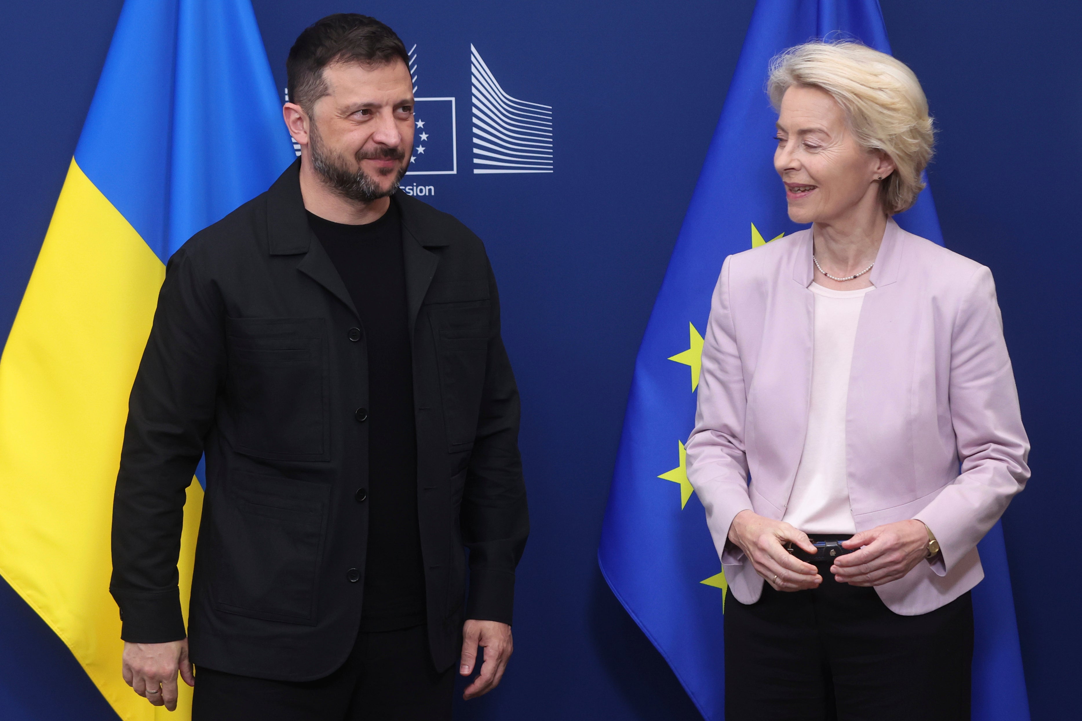 European Commission President Ursula von der Leyen greets Ukraine’s President Volodymyr Zelenskyy in Brussels (AP)