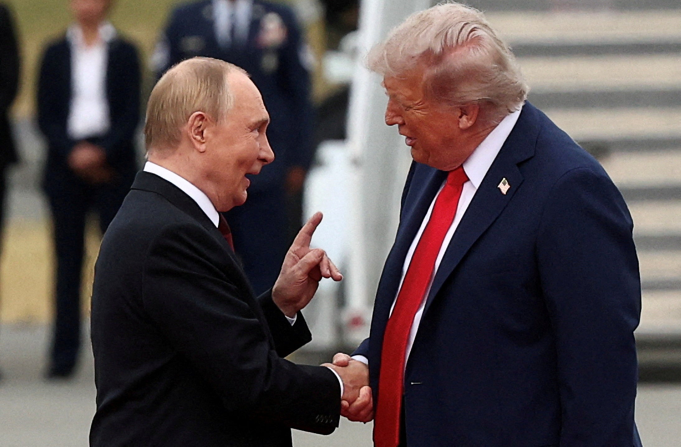Donald Trump shakes hand with Russian President Vladimir Putin, as they meet to negotiate for an end to the war in Ukraine, in Alaska, U.S., August 15, 2025